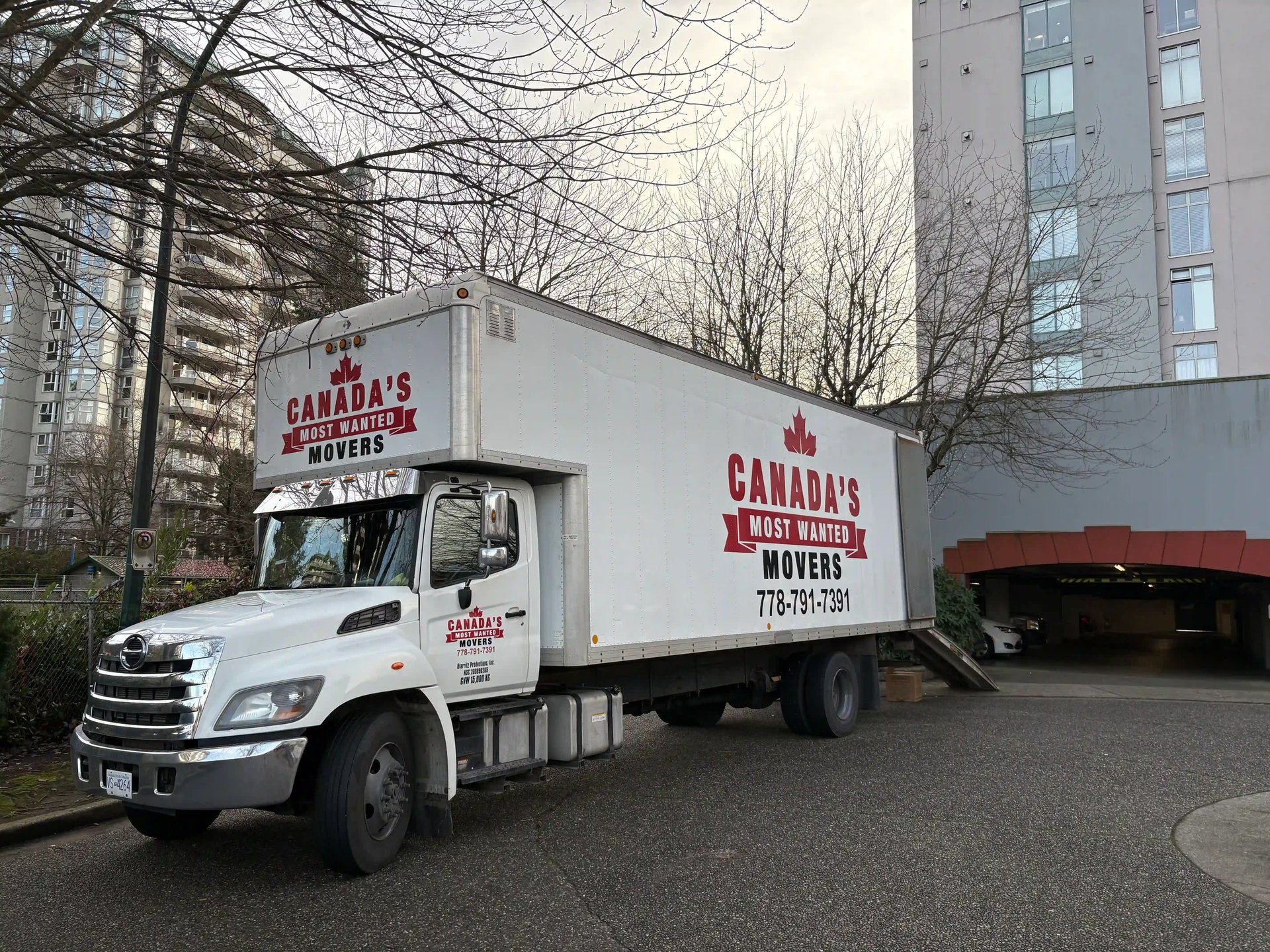Canada’s Most Wanted Movers truck parked beside a construction project in Surrey, ready for a commercial move.