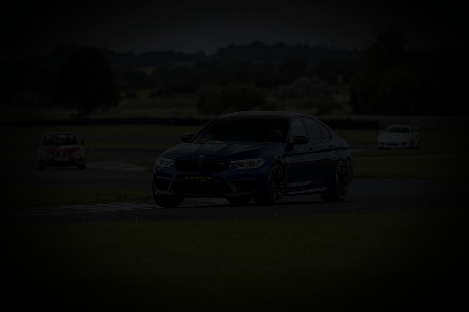 a black background with a curved yellow line