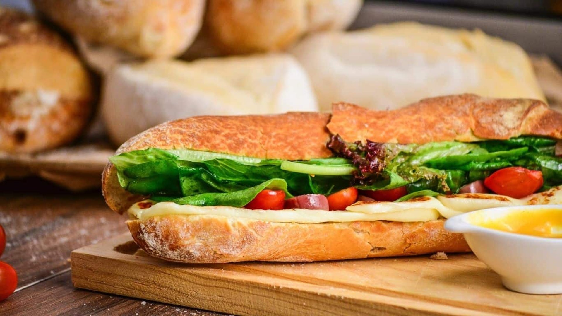 a person holding a sandwich in their hands