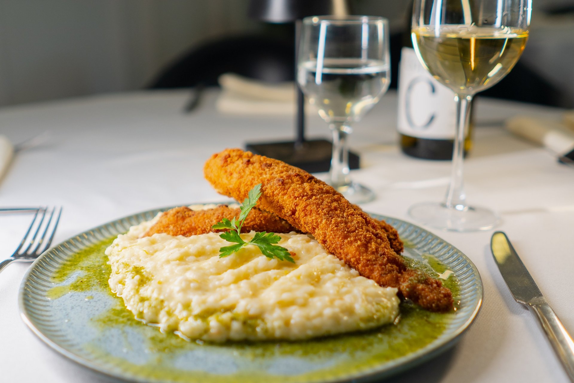 an abstract photo of a curved building with a blue sky in the background