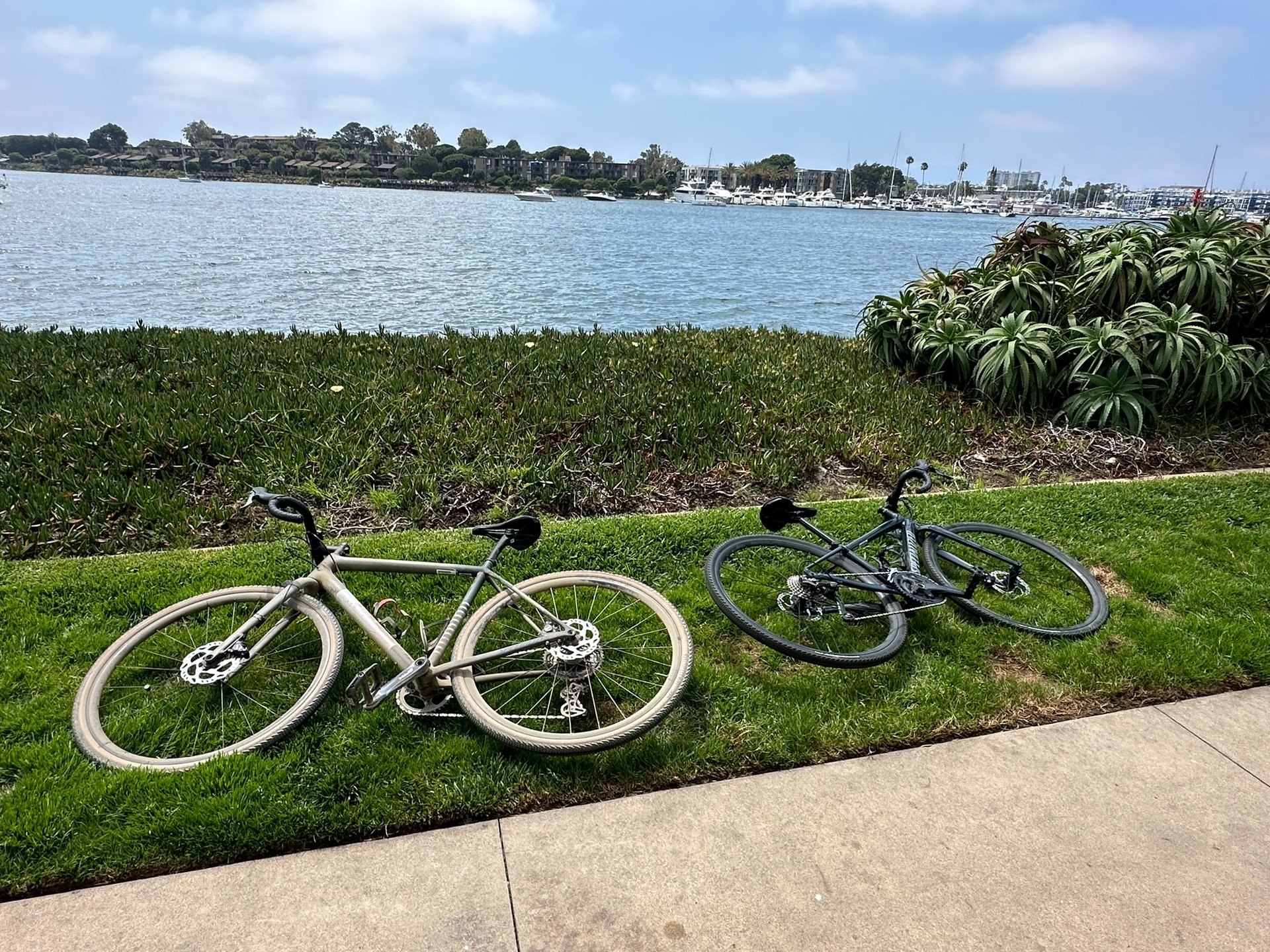 woman wearing yellow long-sleeved dress under white clouds and blue sky during daytime