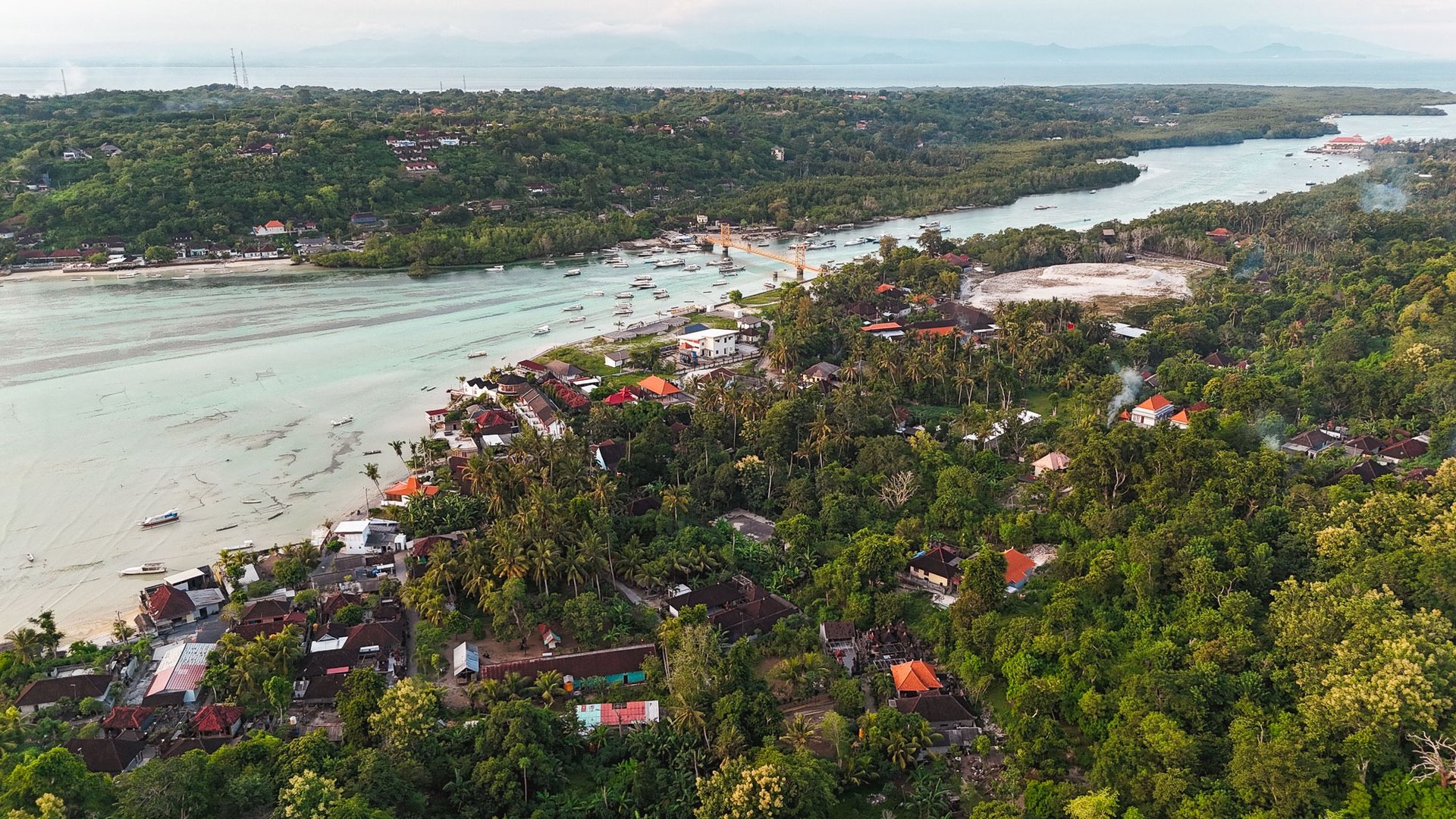 Drone view of Nusa Ceningan and the Yellow Bridge connecting it to Nusa Lembongan.