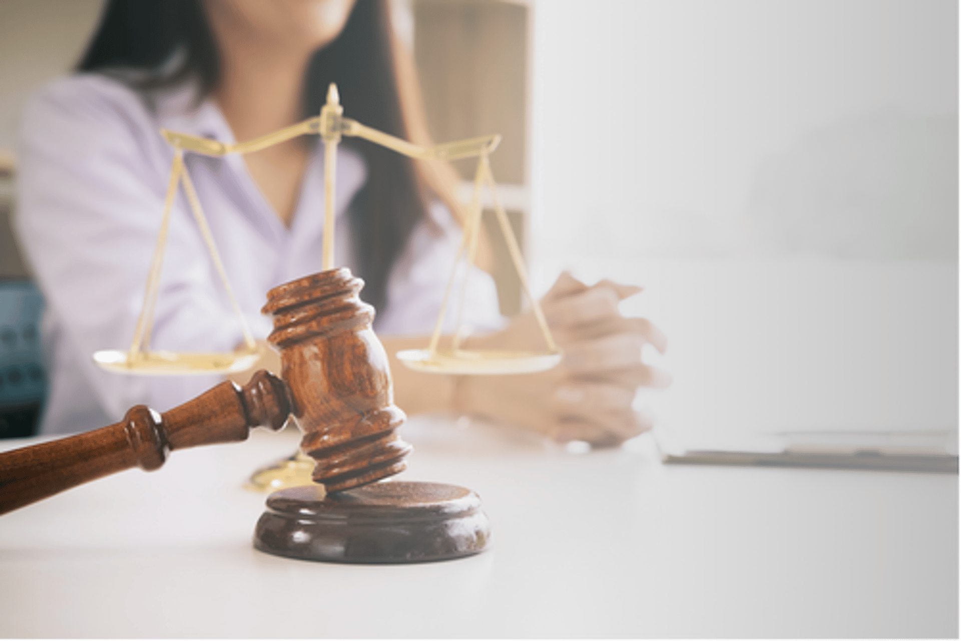 people sitting on chair in front of table while holding pens during daytime