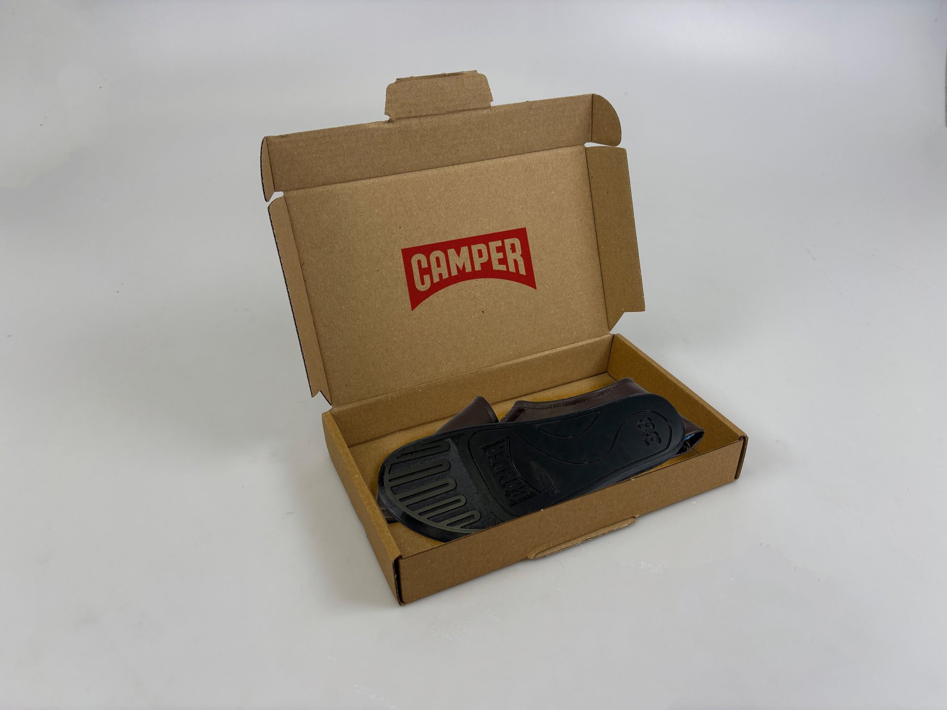 an abstract photo of a curved building with a blue sky in the background