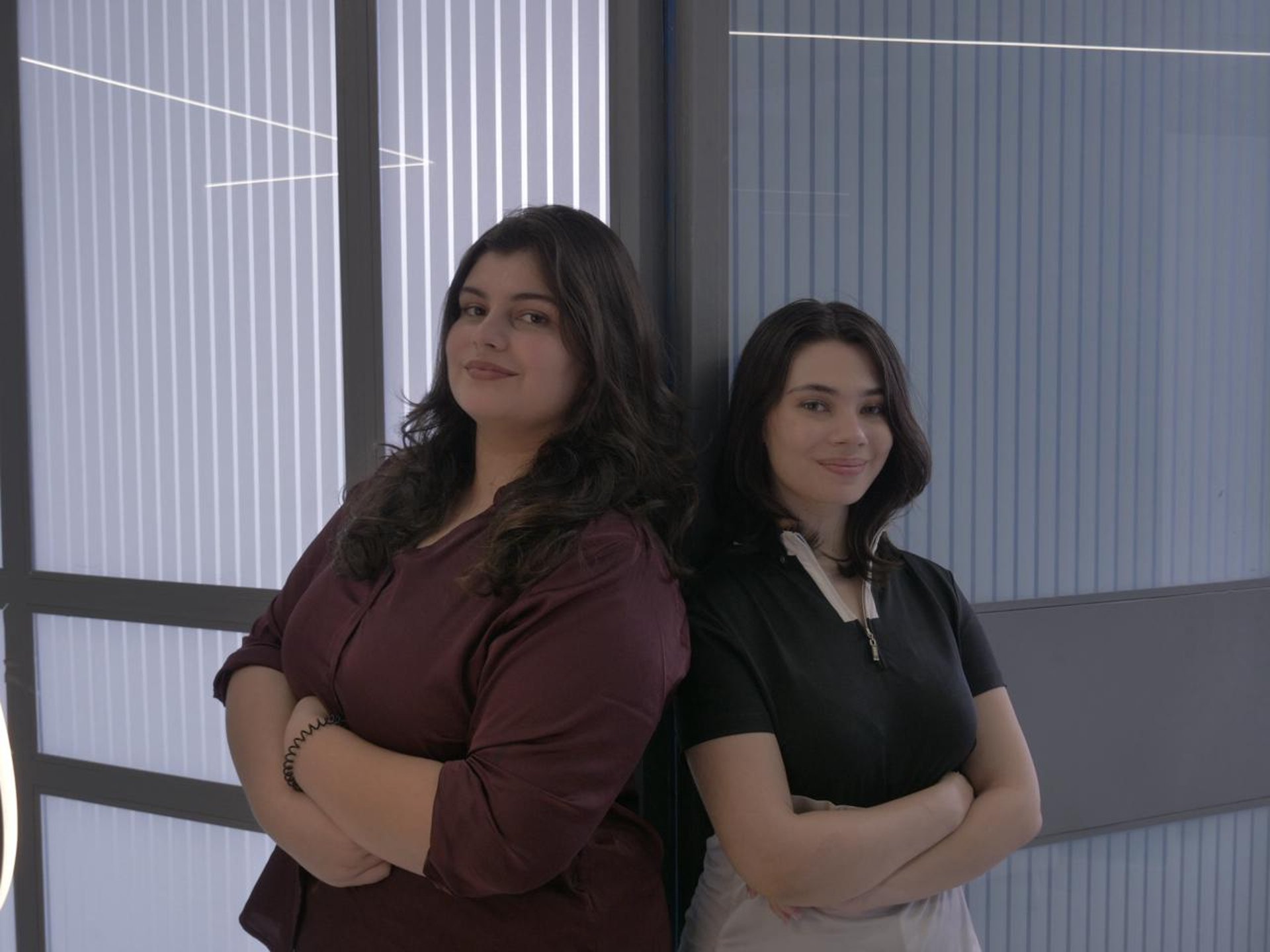 an abstract photo of a curved building with a blue sky in the background