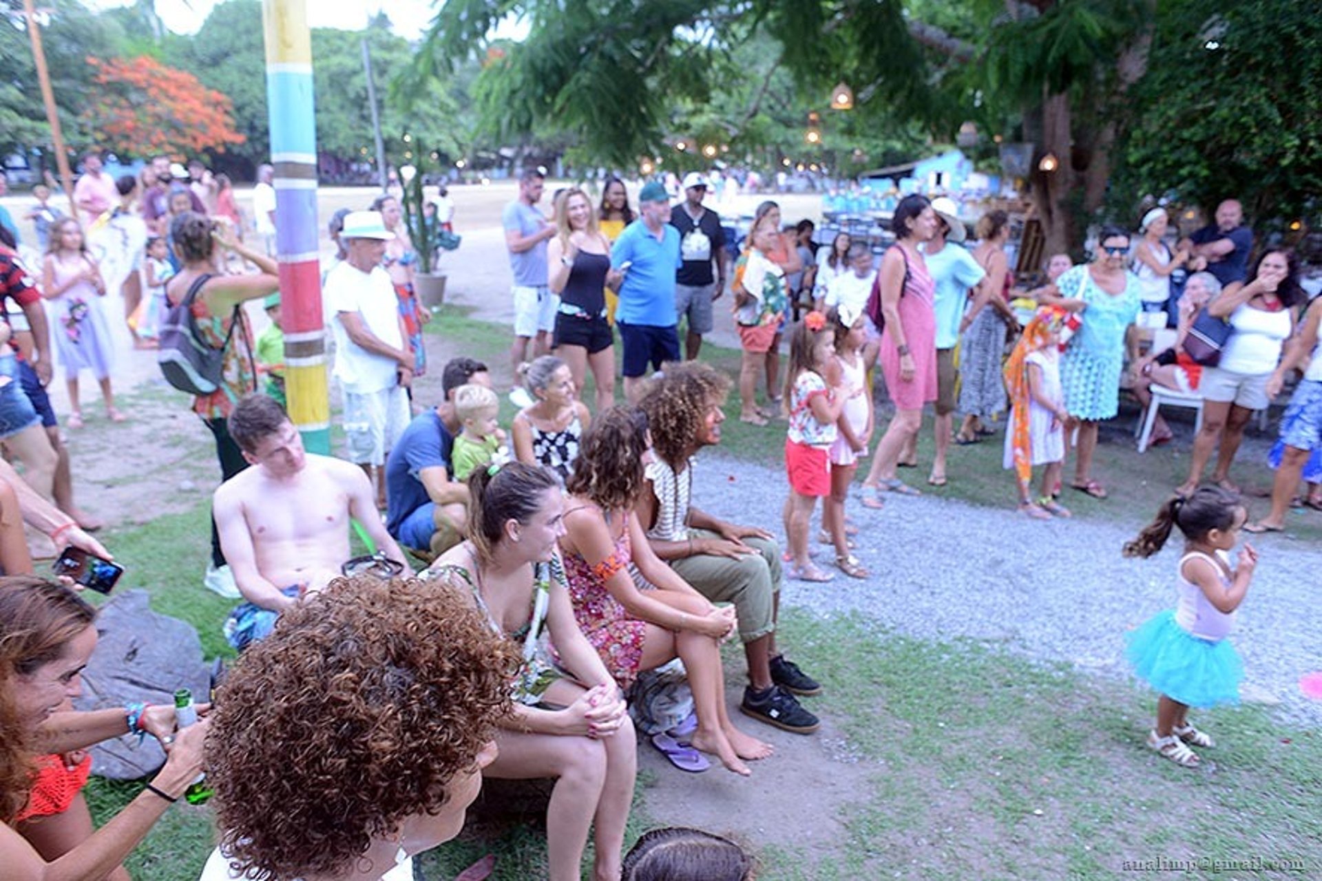 woman wearing yellow long-sleeved dress under white clouds and blue sky during daytime