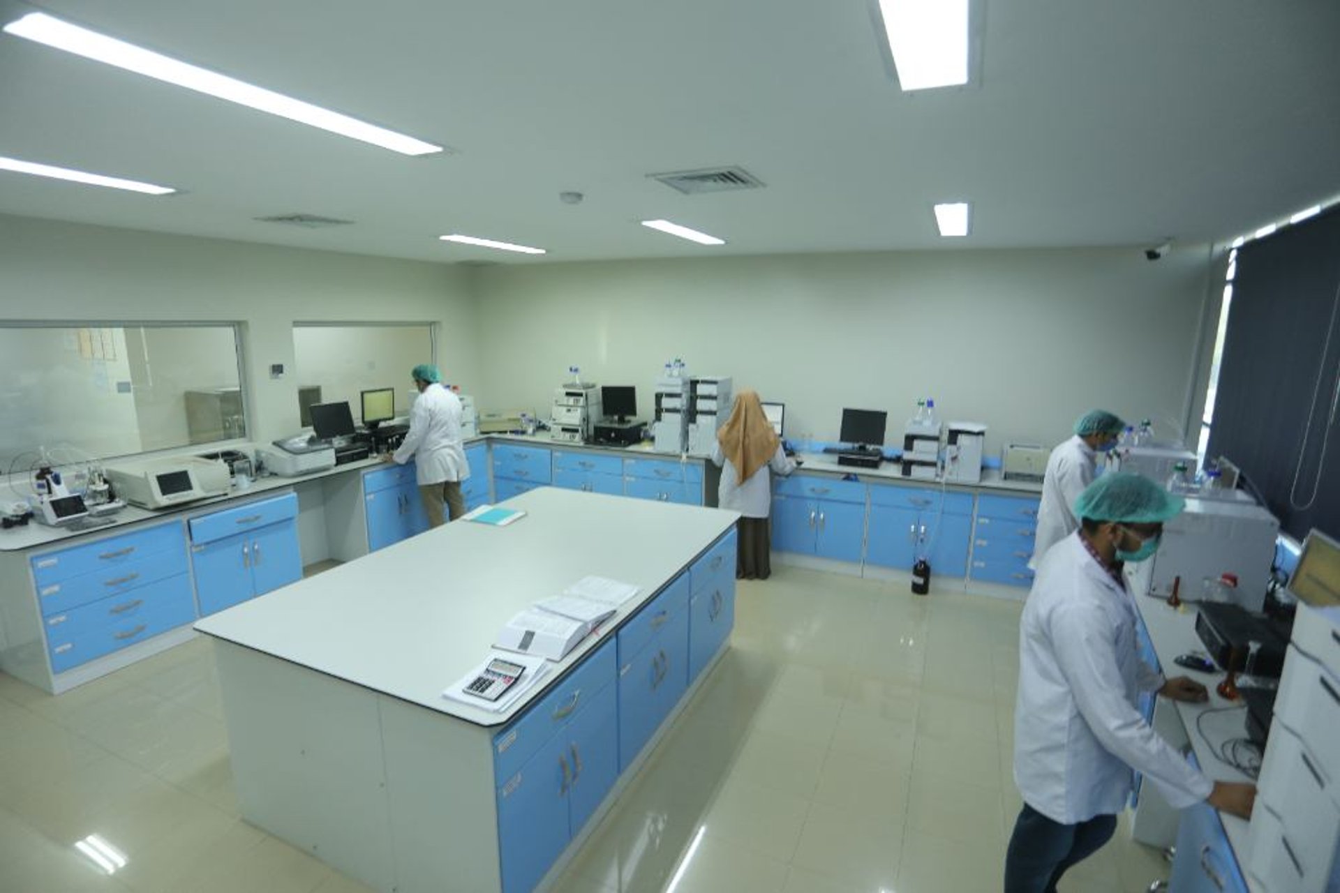 an abstract photo of a curved building with a blue sky in the background