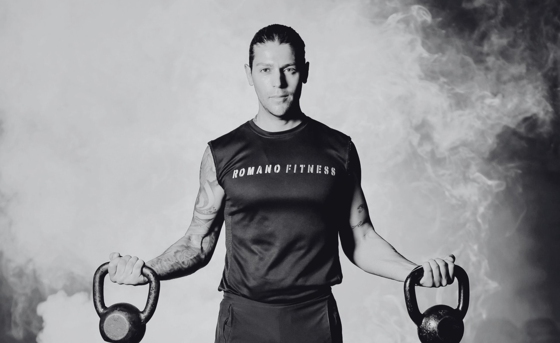 black and brown leather padded tub sofa