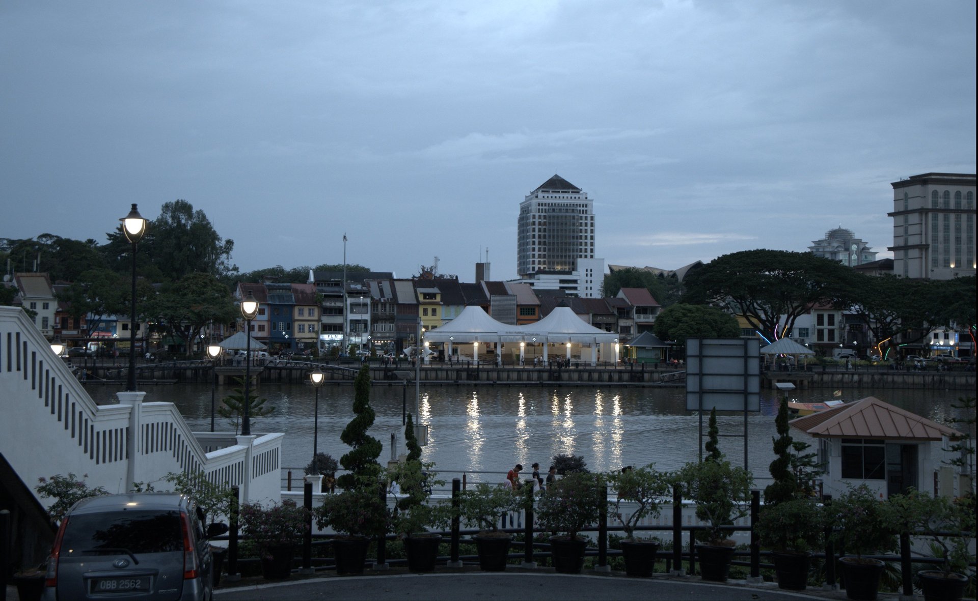 Buildings overlook the water on an overcast day.