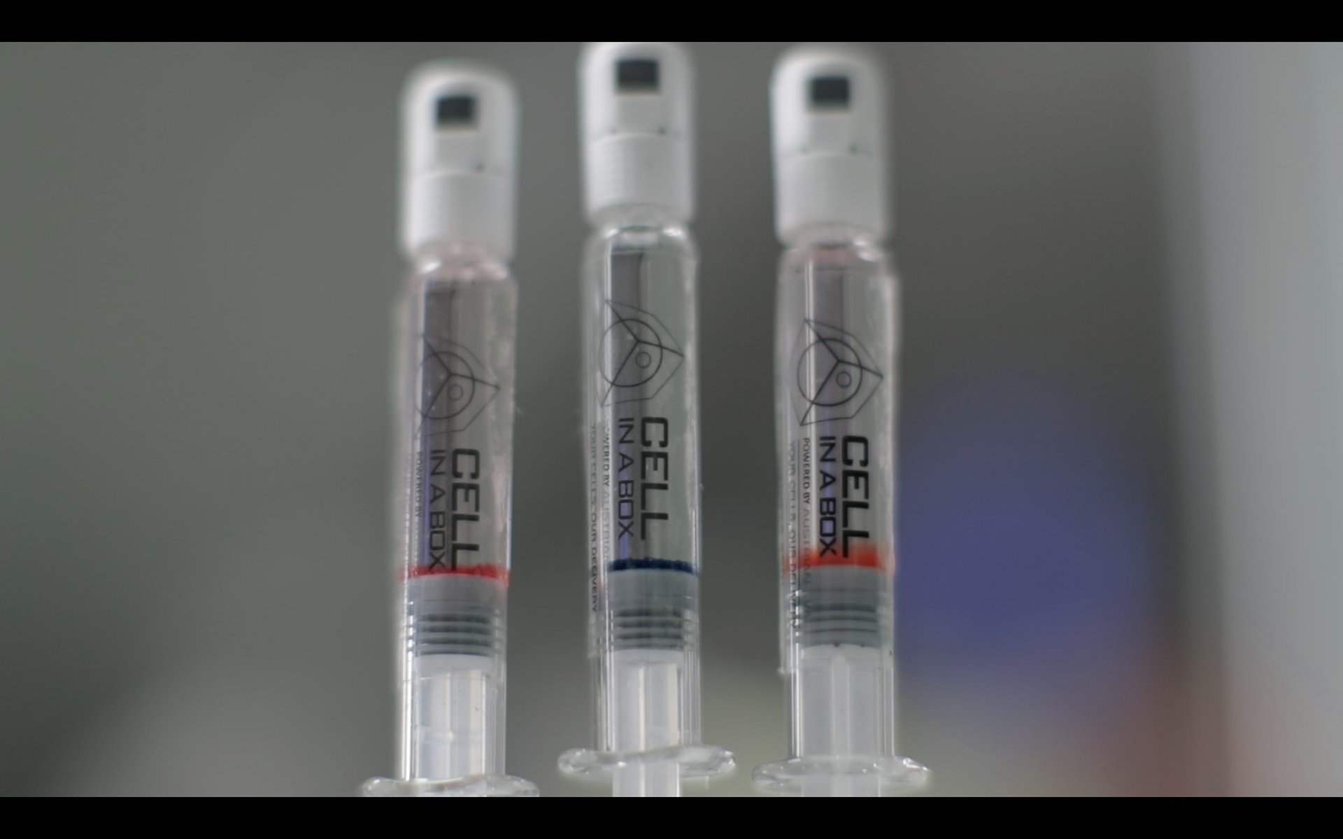 an abstract photo of a curved building with a blue sky in the background