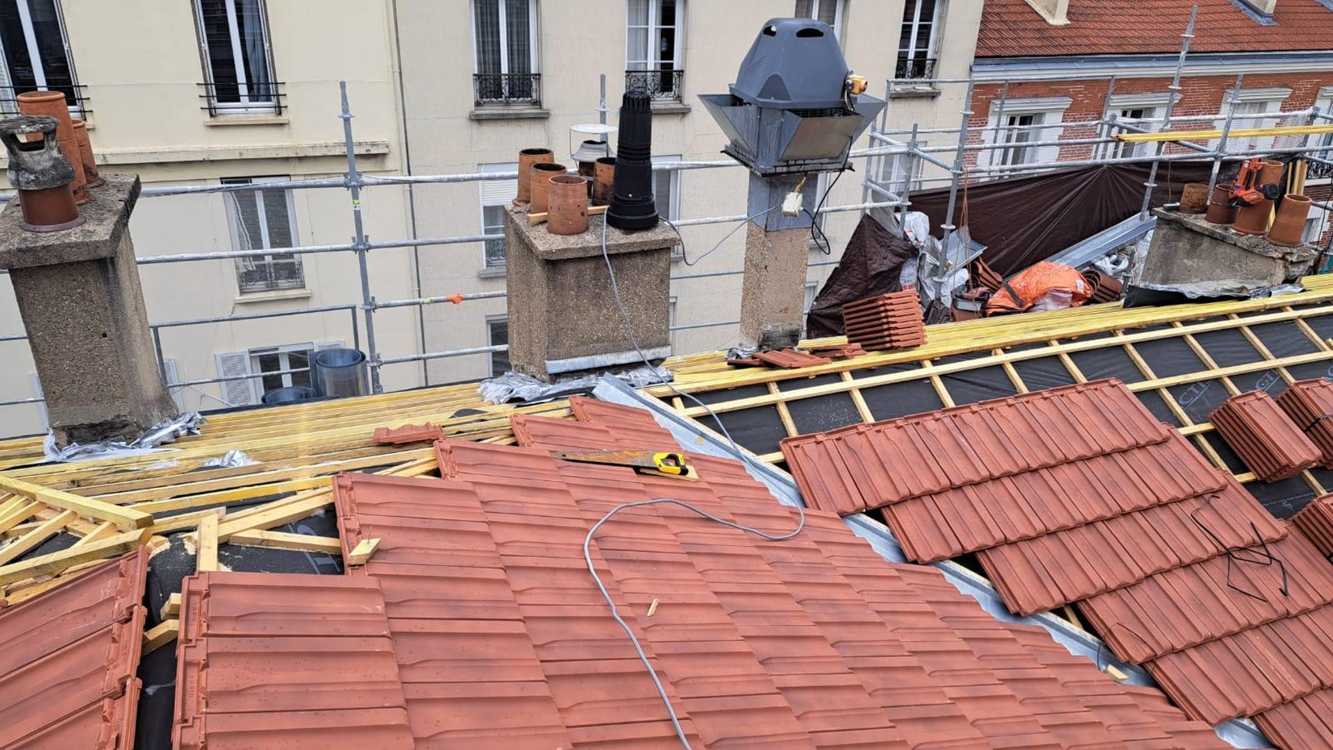 person in blue pants sitting on brown wooden floor