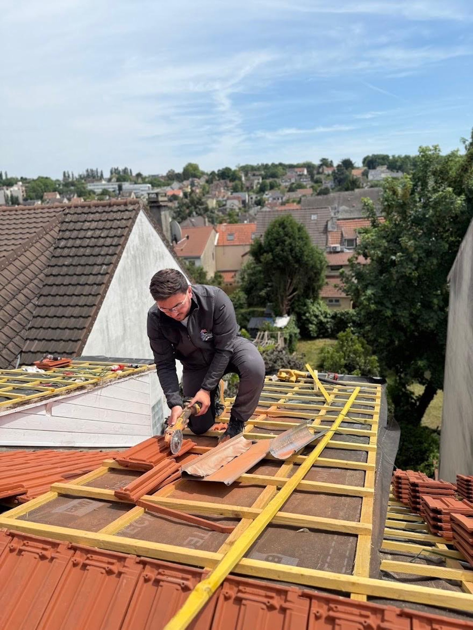 A man on a roof working on a roof