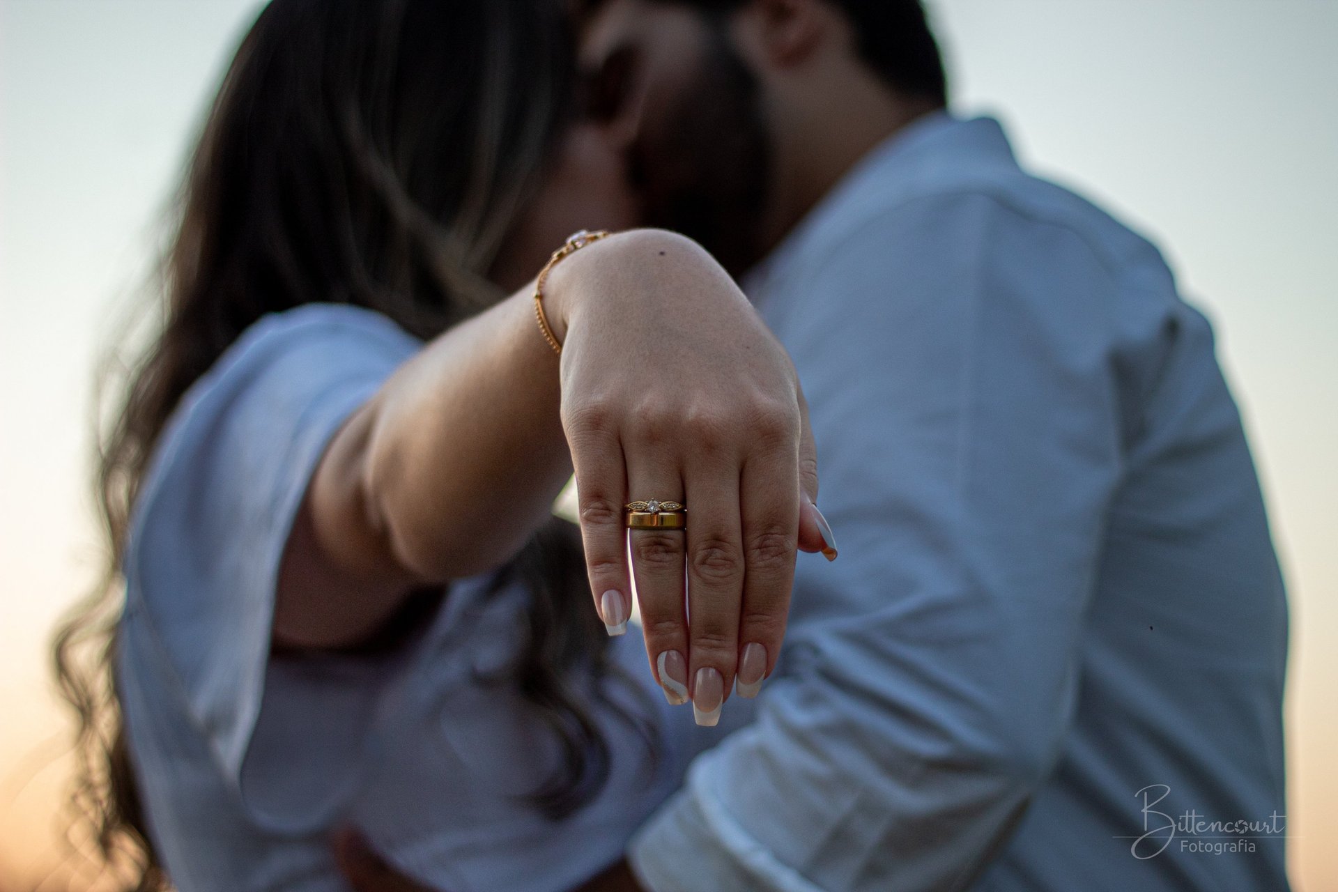 couple wearing silver-colored rings