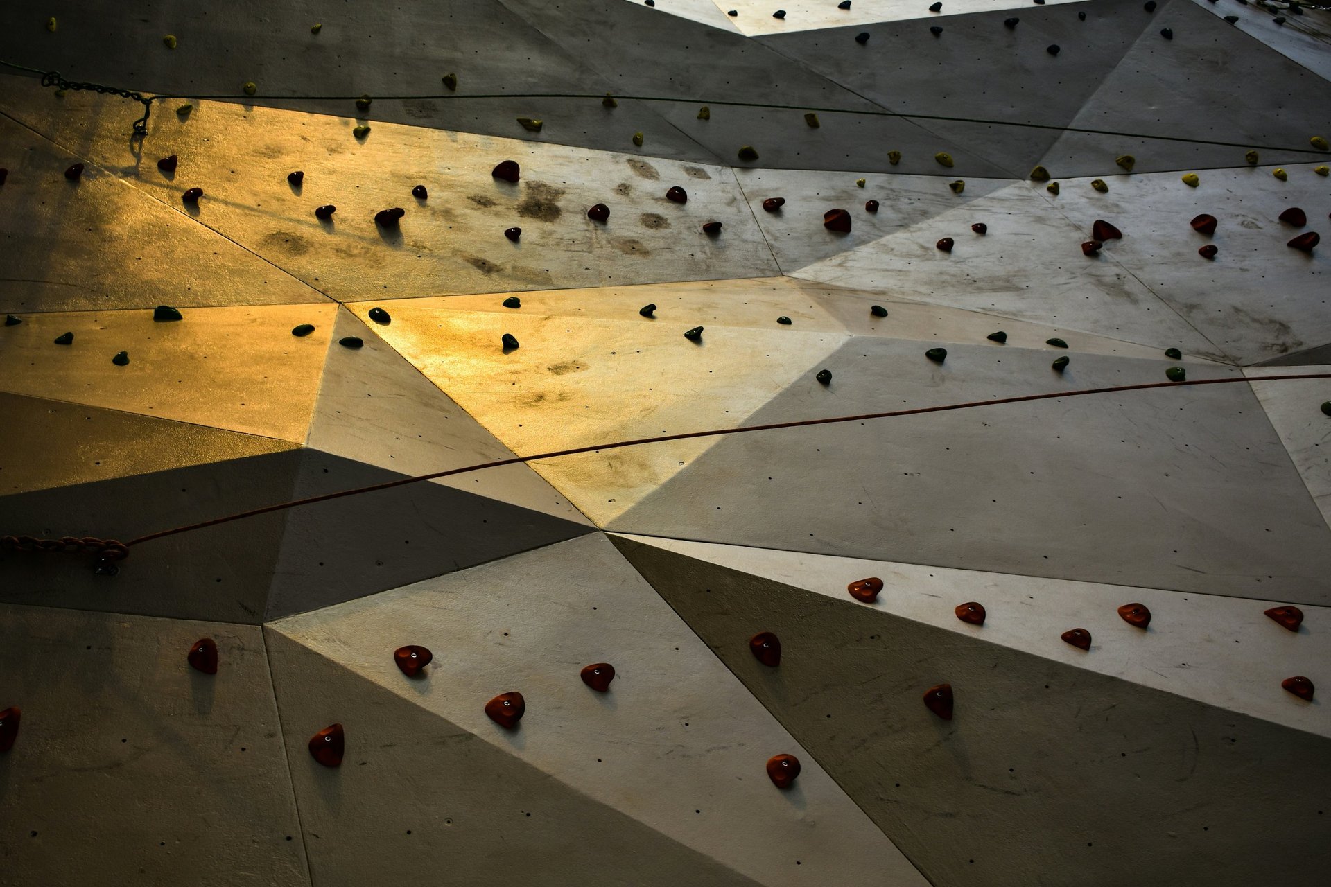 an abstract photo of a curved building with a blue sky in the background