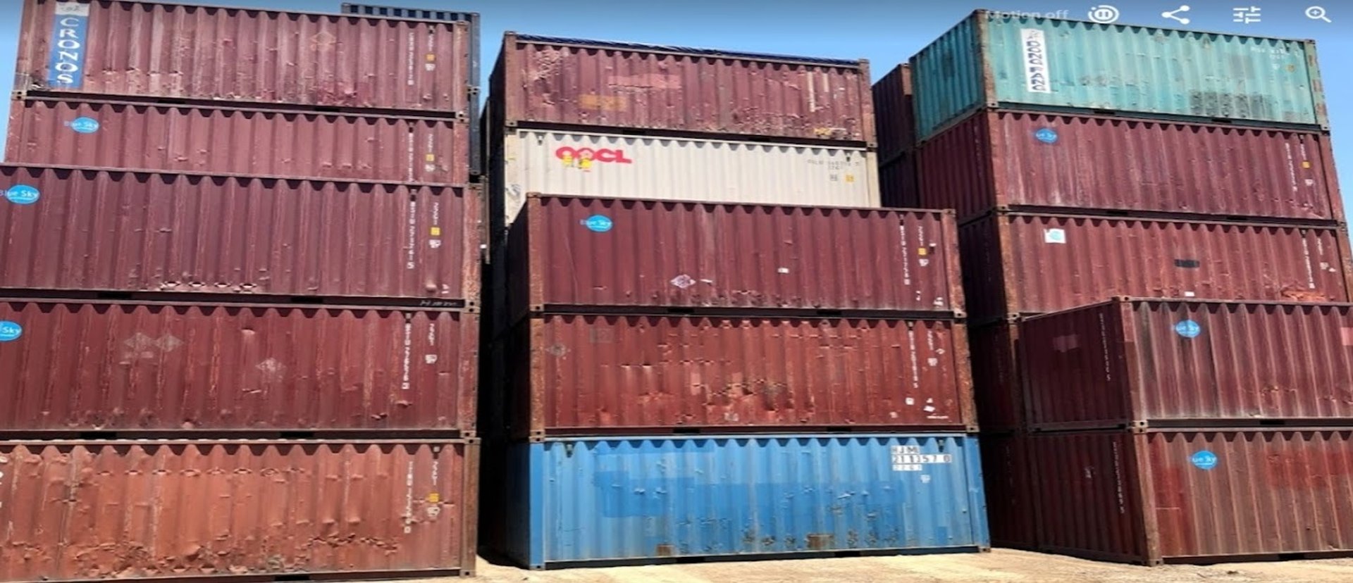 an abstract photo of a curved building with a blue sky in the background