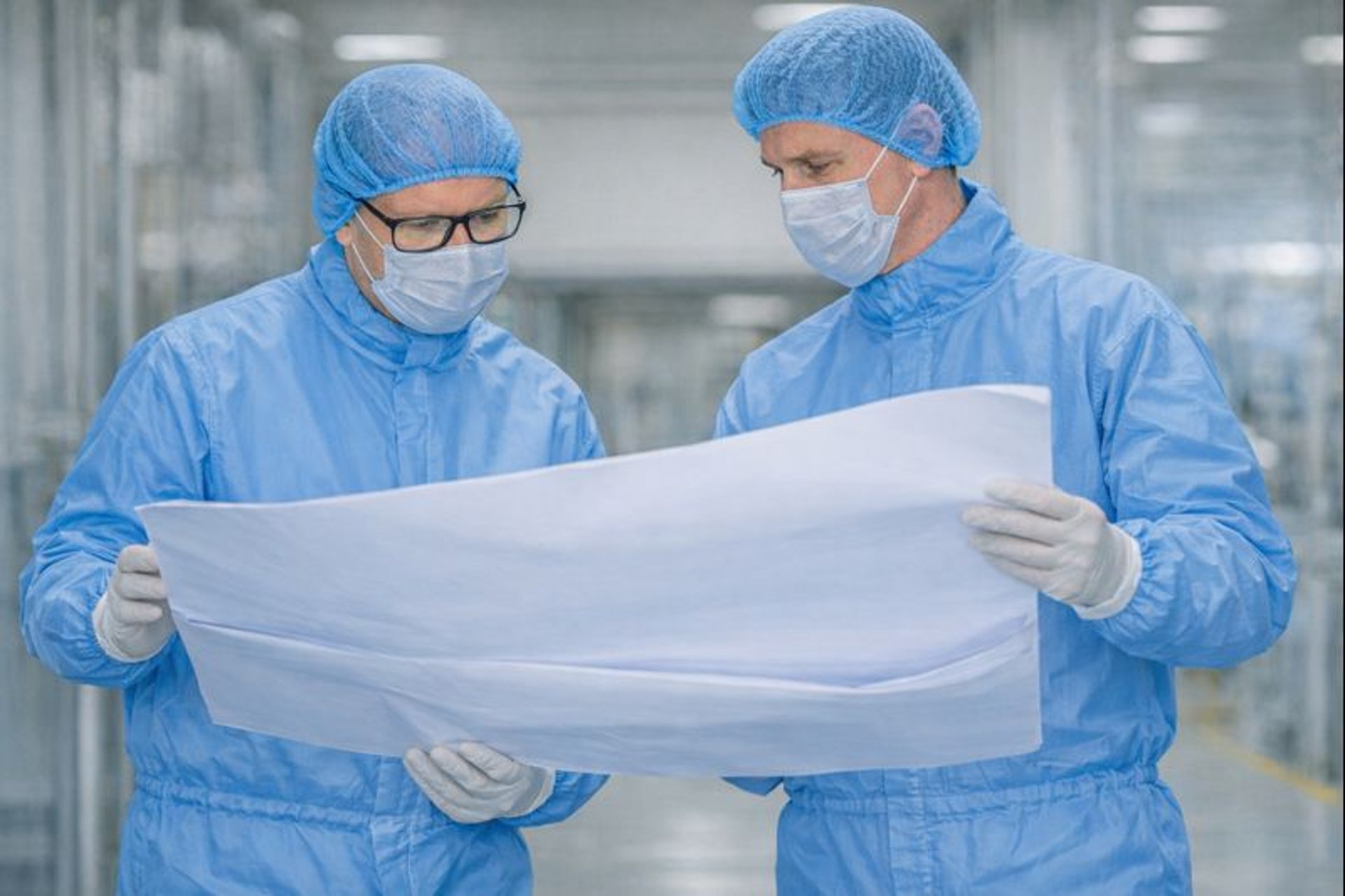 an abstract photo of a curved building with a blue sky in the background