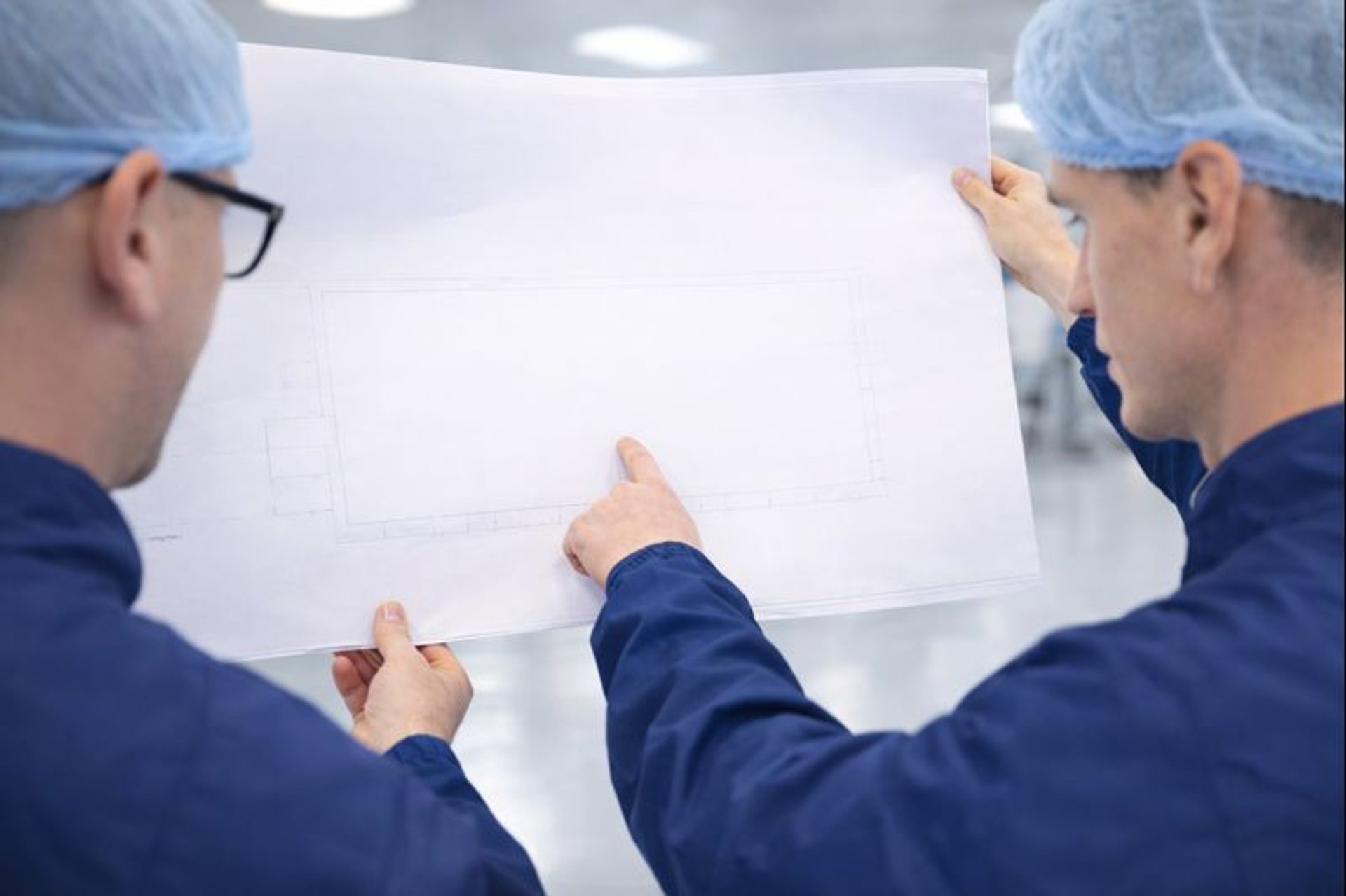 an abstract photo of a curved building with a blue sky in the background