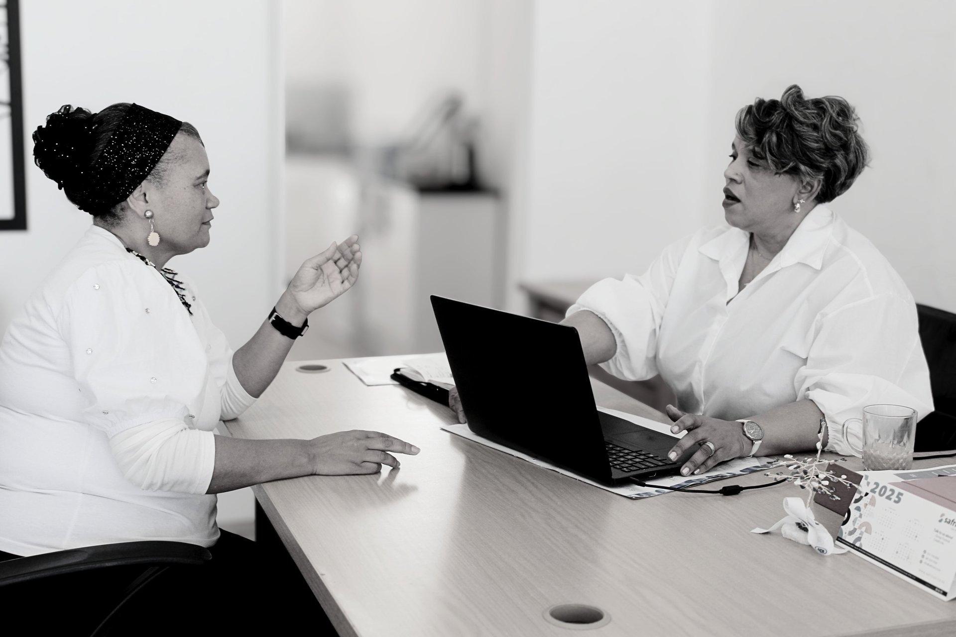 an abstract photo of a curved building with a blue sky in the background