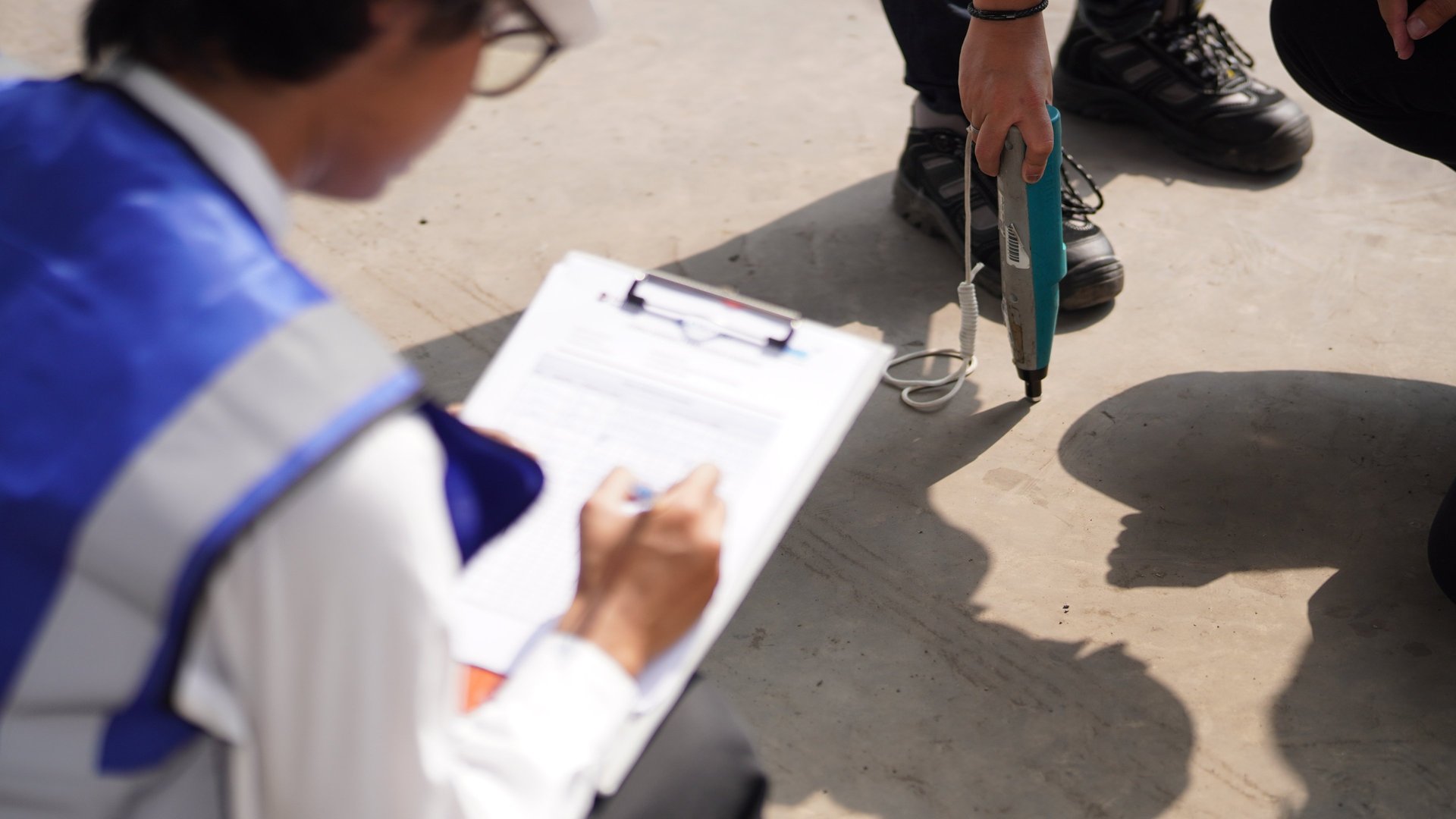gray tripod on brown rock