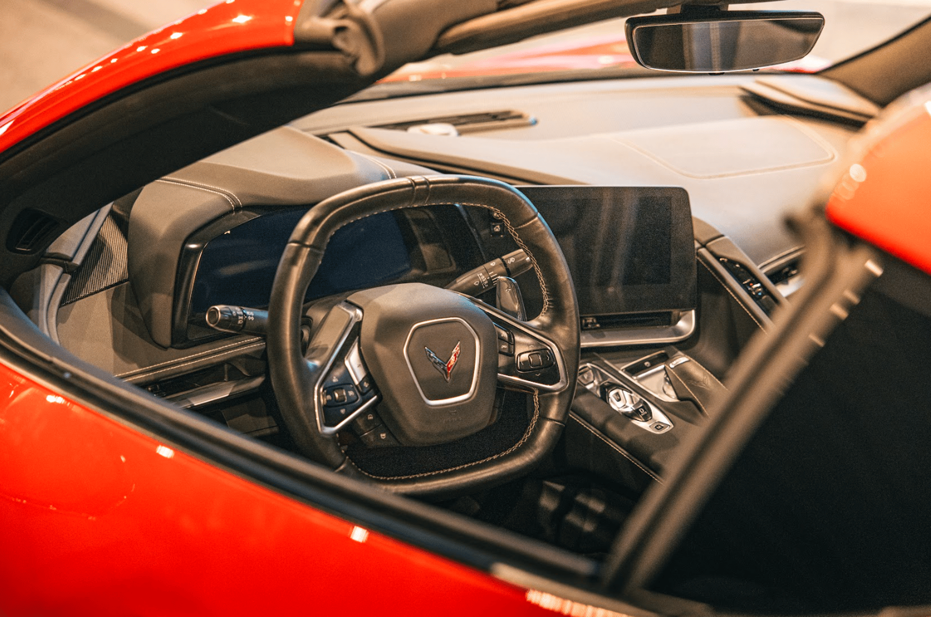 a close up of the hood of a red car