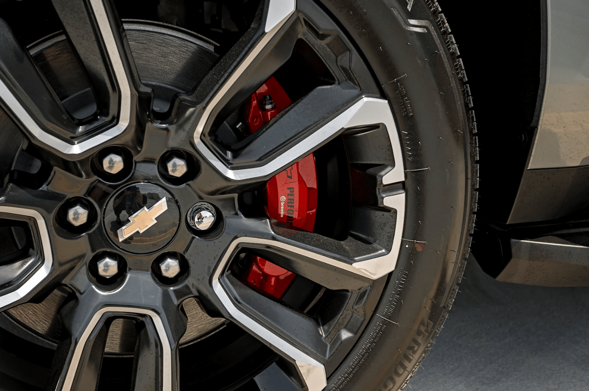 a red sports car parked in a parking lot