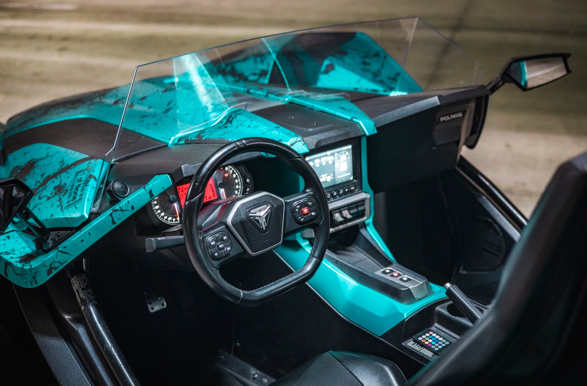 a close up of the hood of a red car