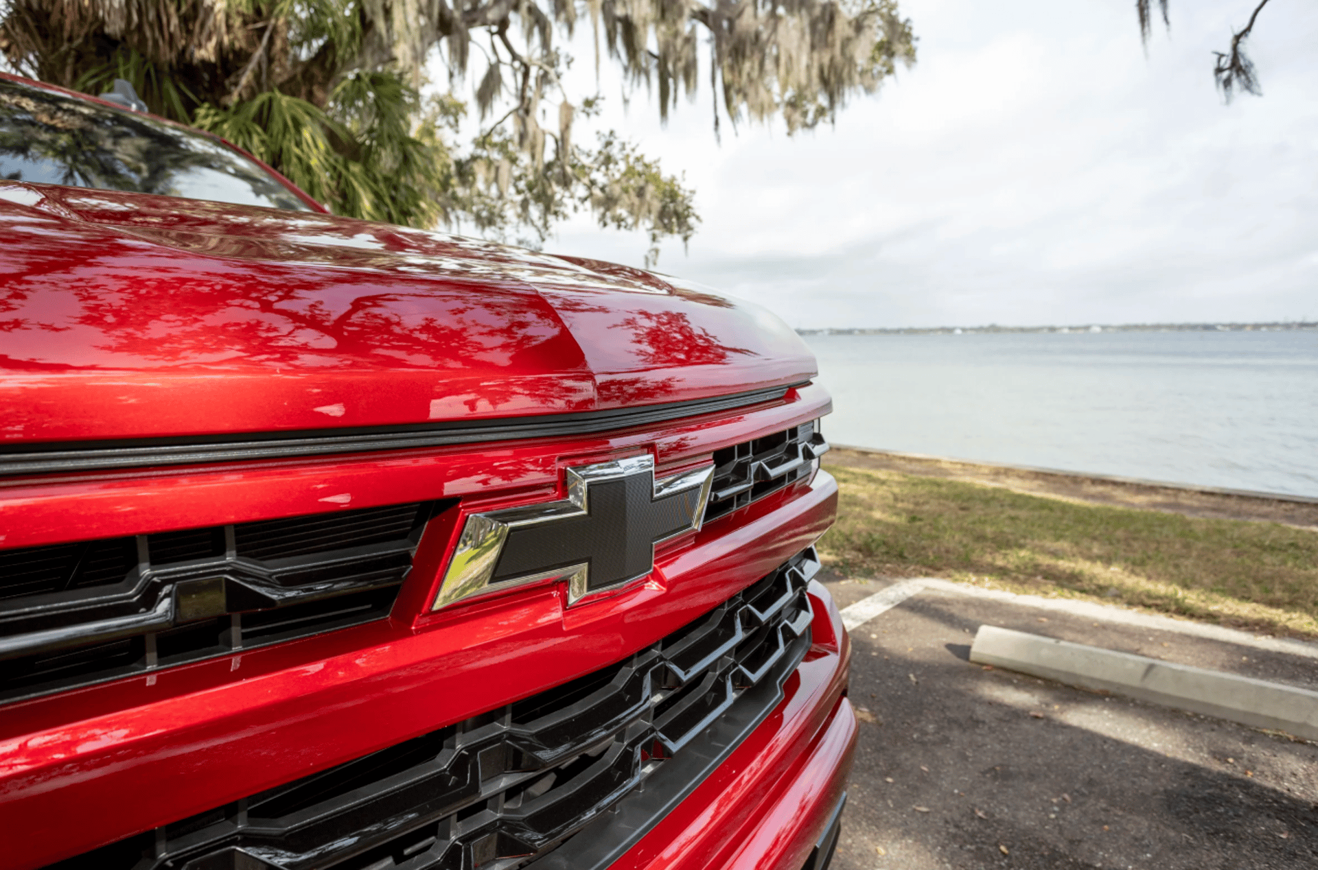 a red sports car parked in a parking lot