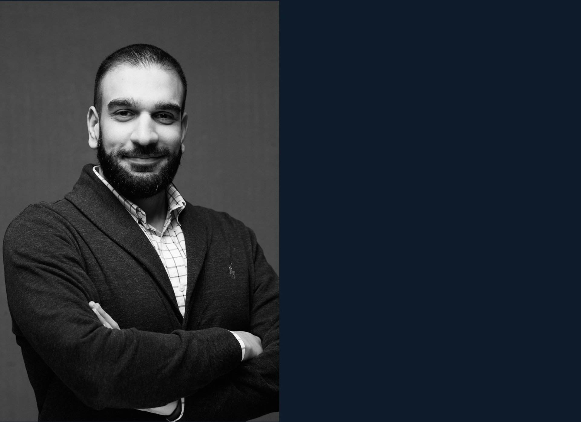 an abstract photo of a curved building with a blue sky in the background