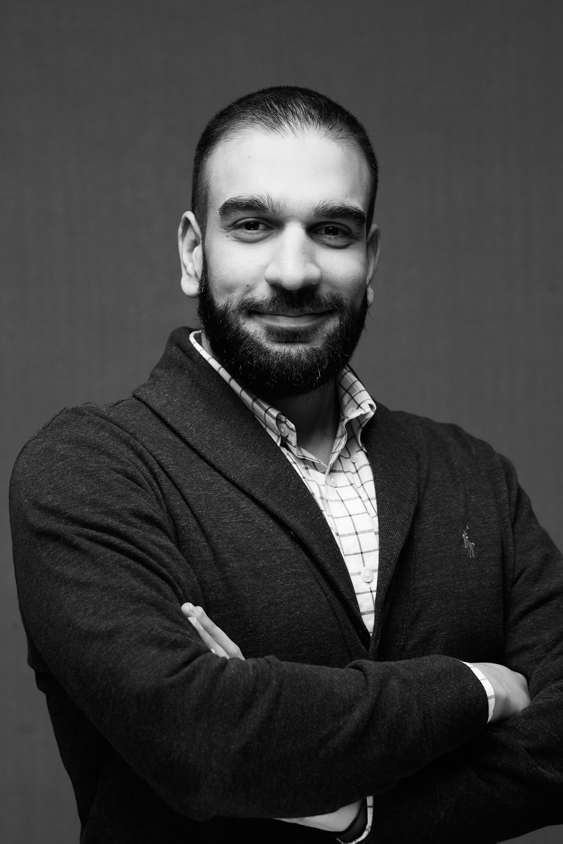 an abstract photo of a curved building with a blue sky in the background