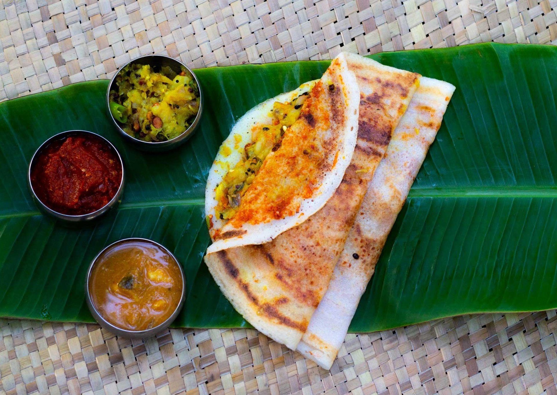 woman wearing yellow long-sleeved dress under white clouds and blue sky during daytime