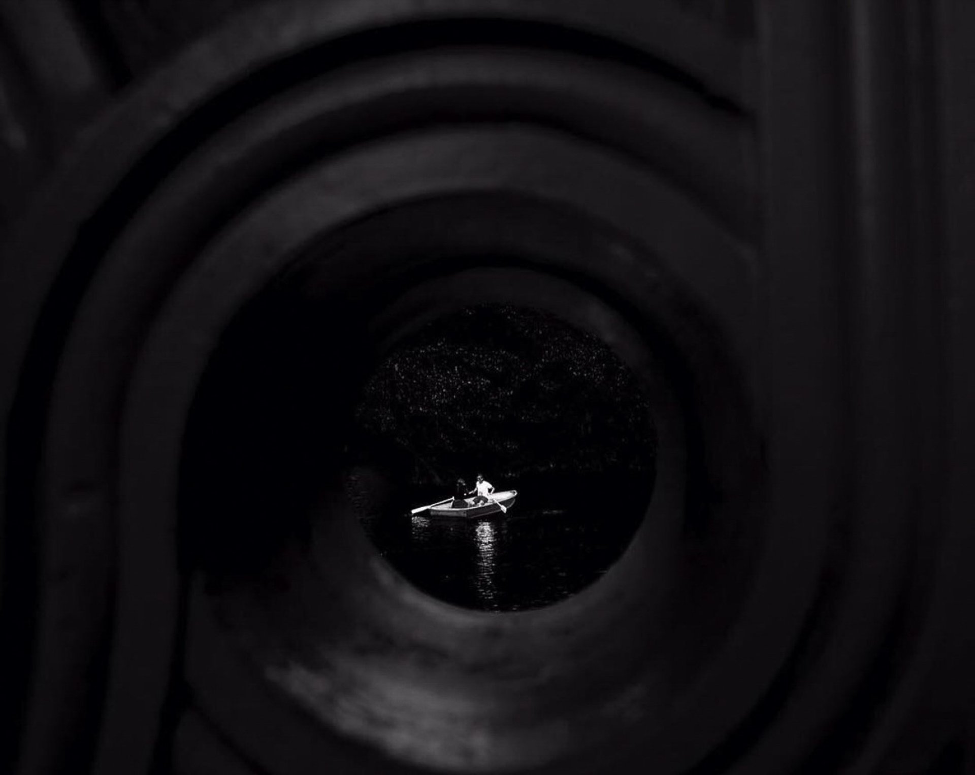 an abstract photo of a curved building with a blue sky in the background