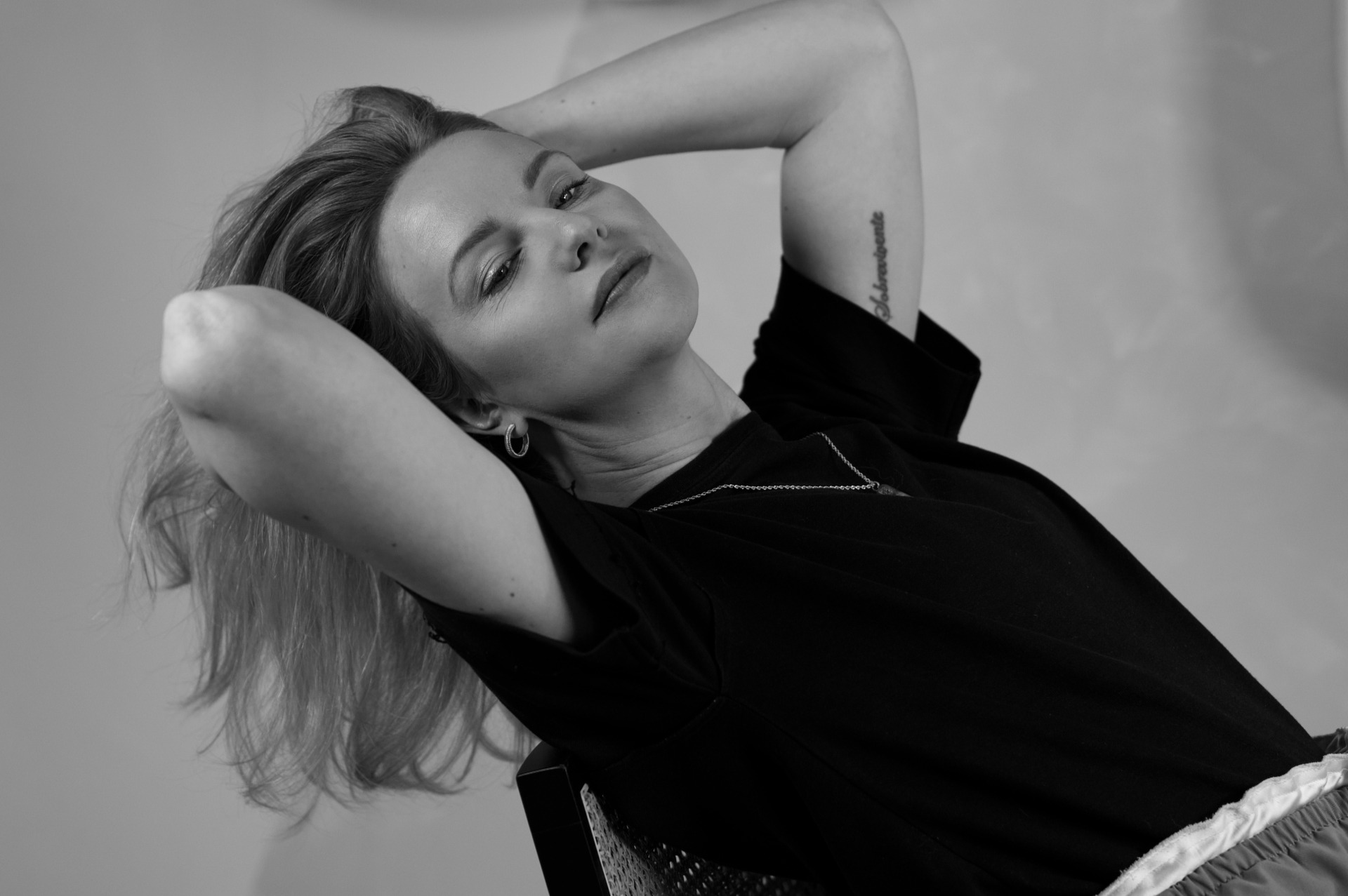 an abstract photo of a curved building with a blue sky in the background