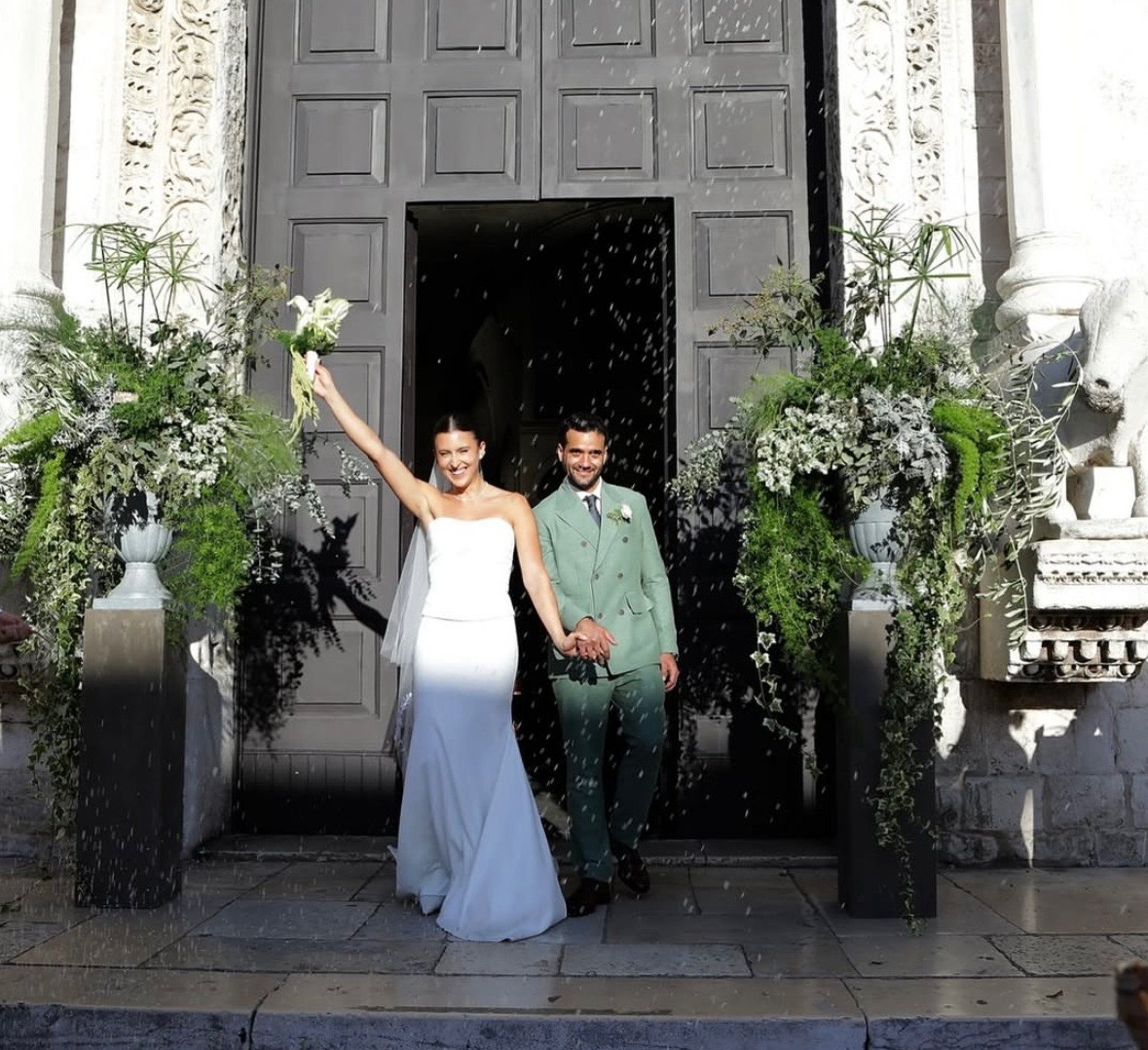 an abstract photo of a curved building with a blue sky in the background