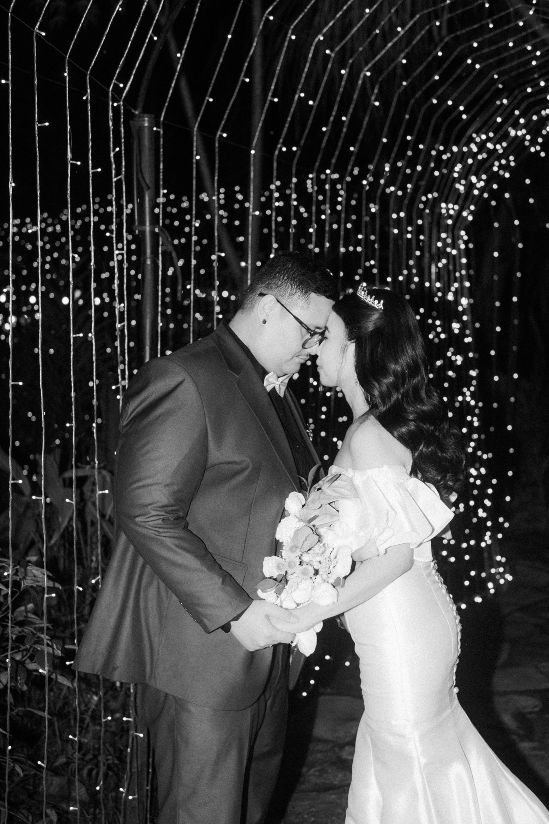 groom beside bride holding bouquet flowers