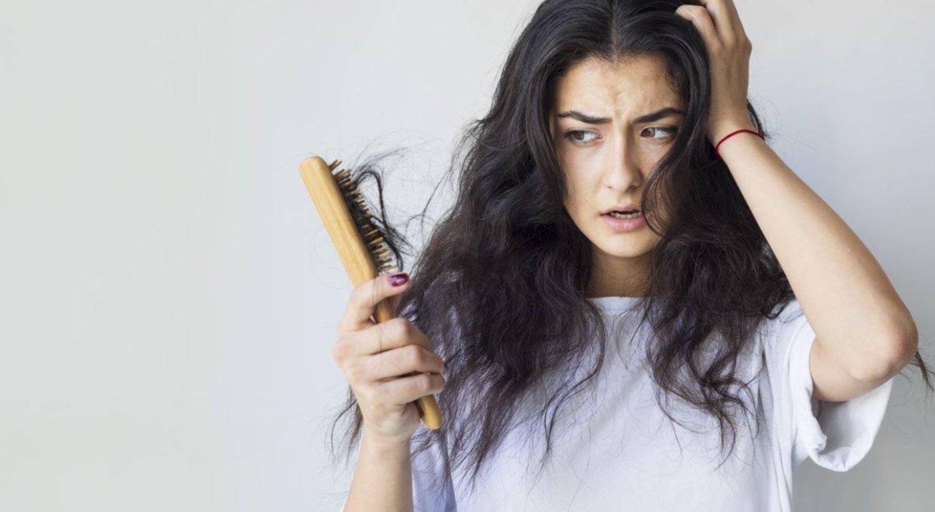 person wearing grey knit sweater