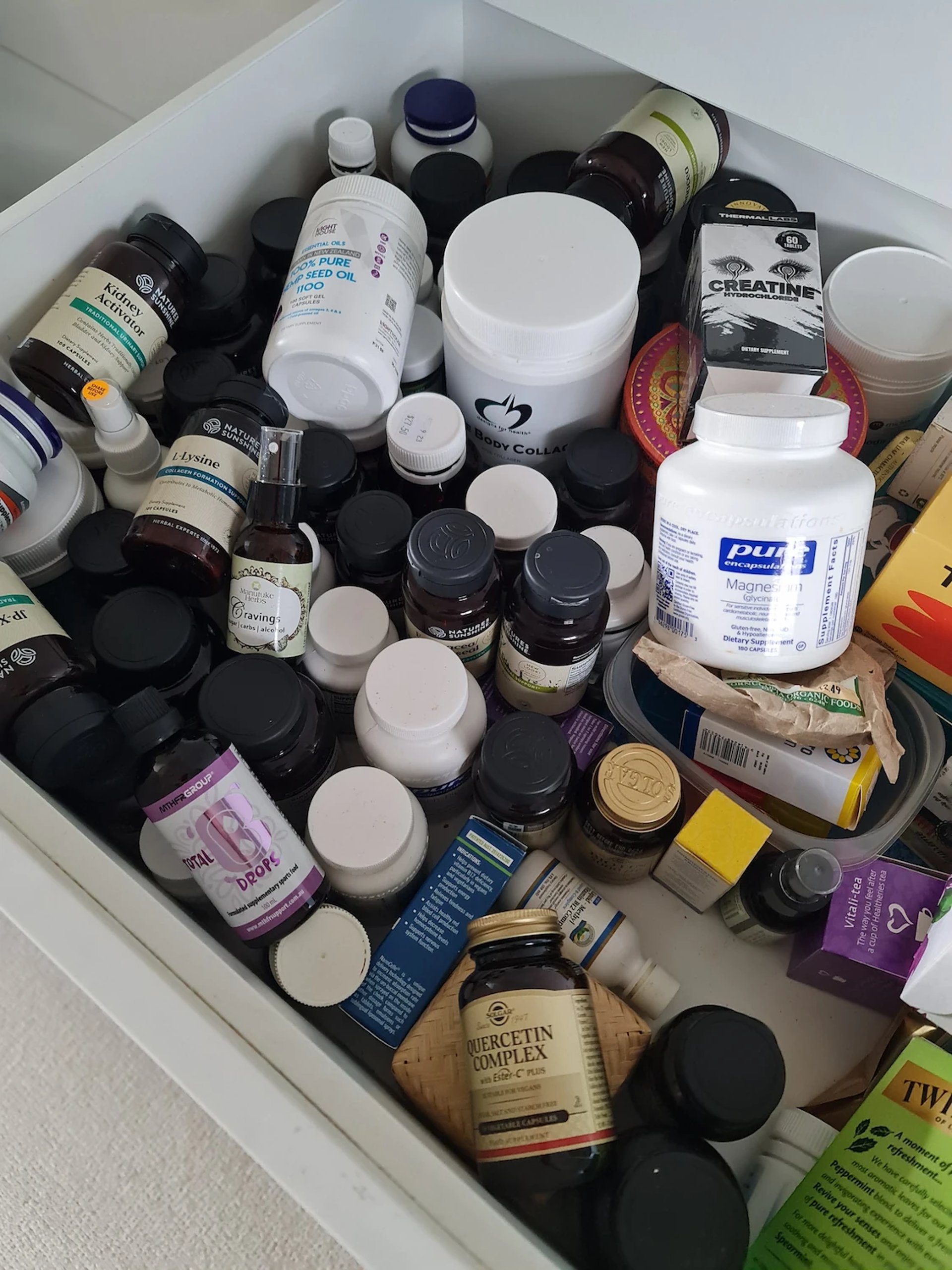 Before Holy Fusion: a drawer of pills, powders, and capsules used for daily health.