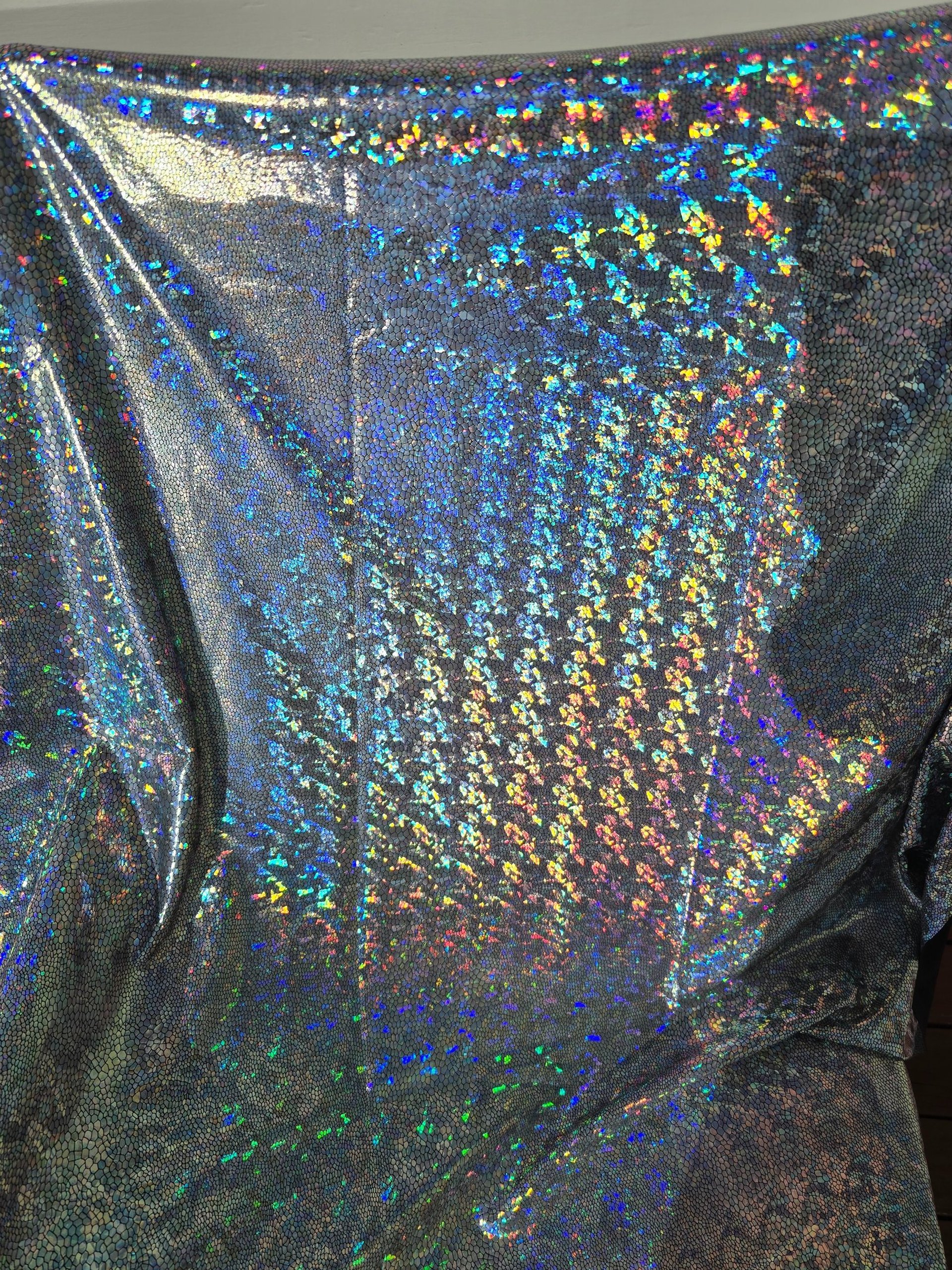 Holographic material ready to be crafted into a sash