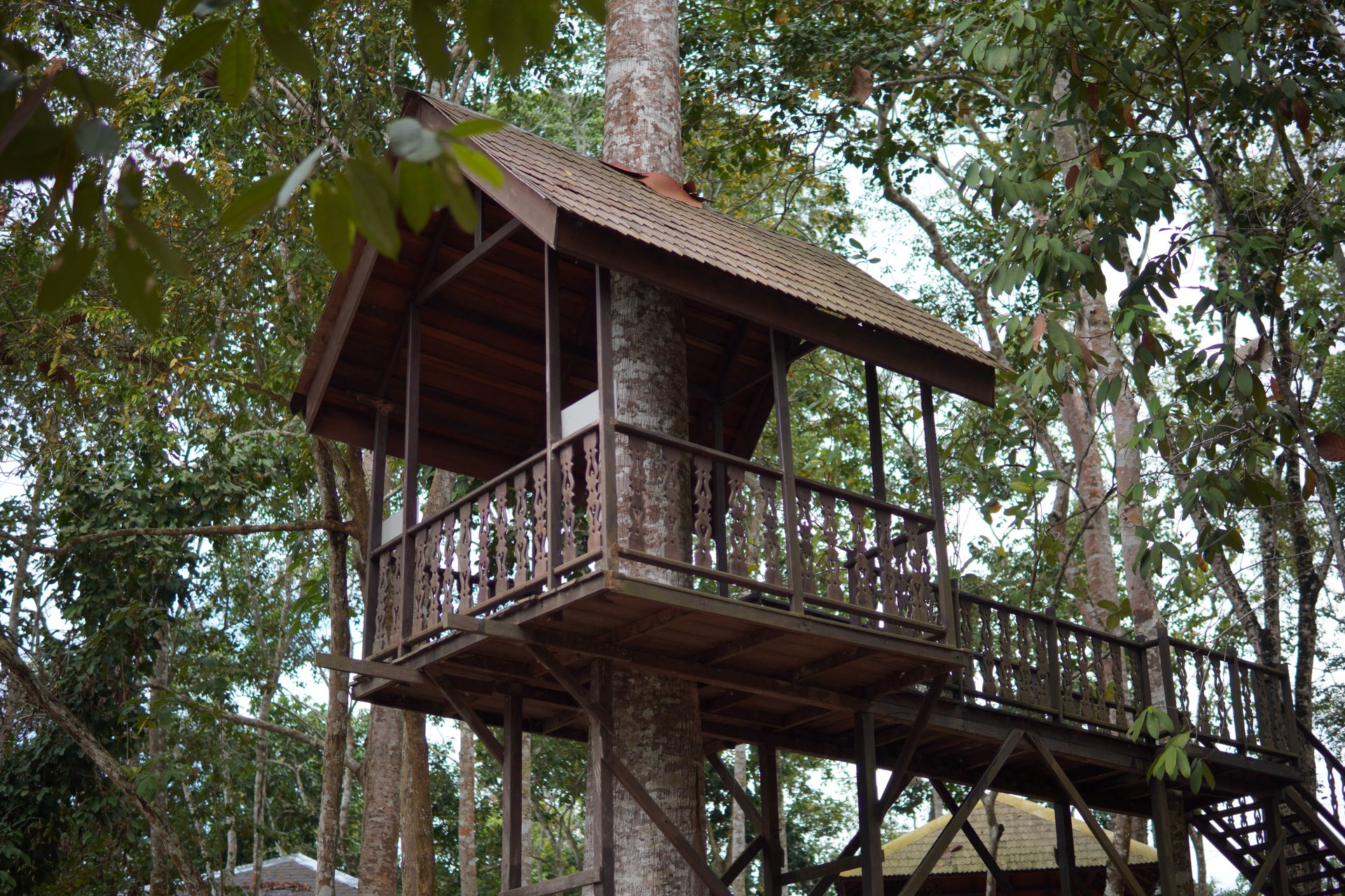 empty hallway between concrete buildings during daytime