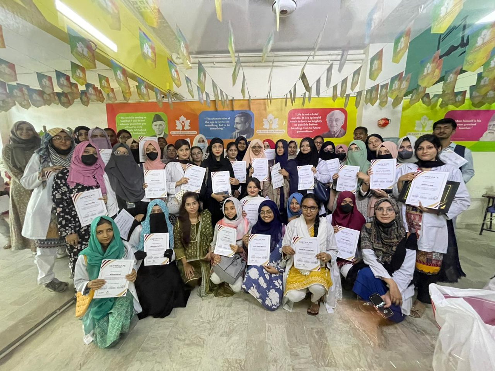 People attending a presentation or seminar indoors.