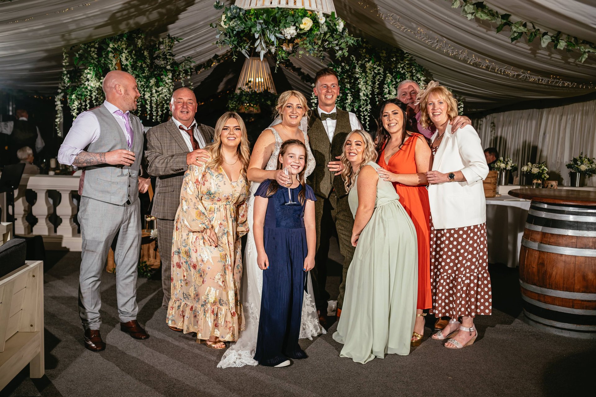 Late night group photograph of a bride and groom and family at llanerch