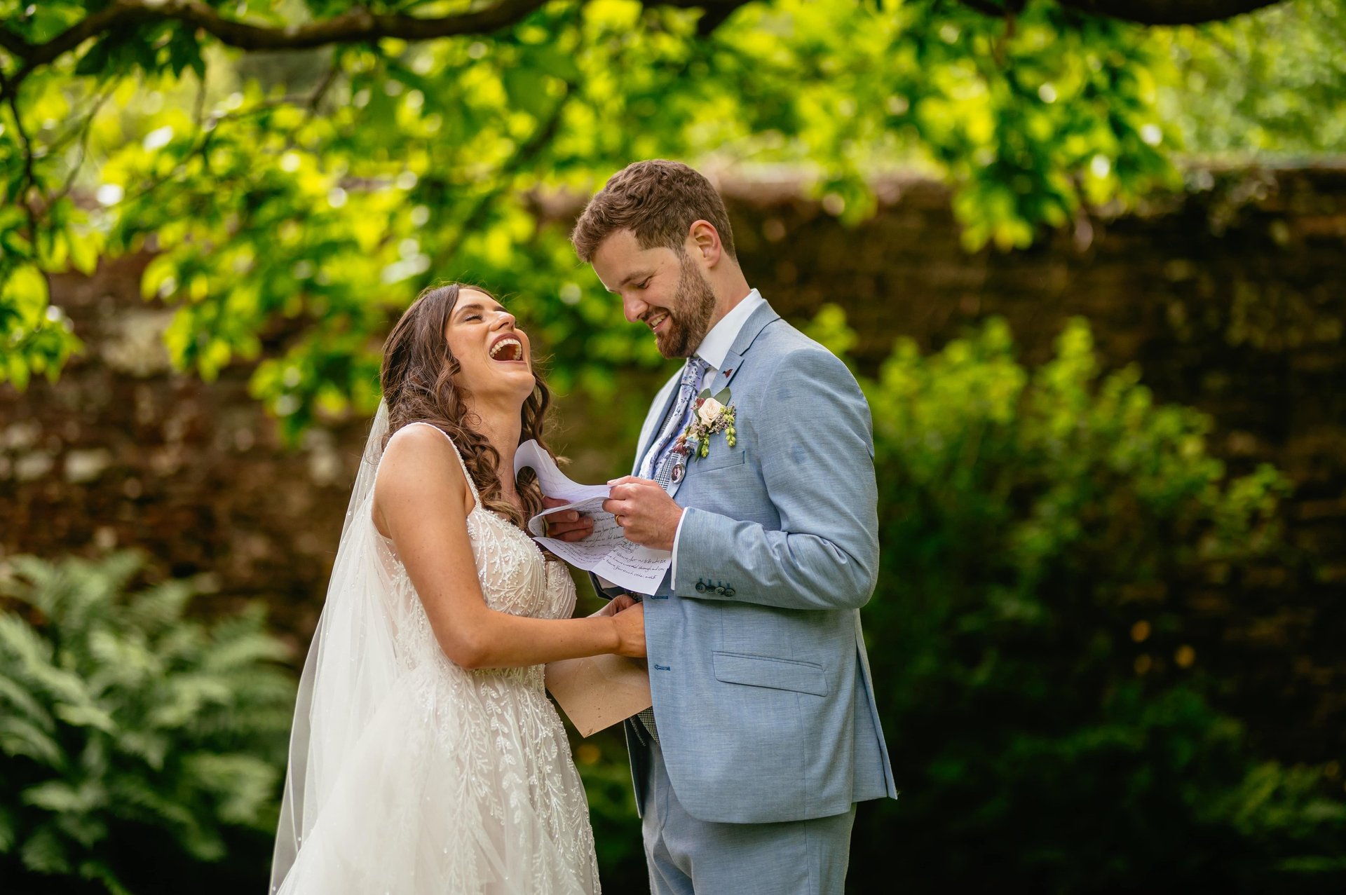 Bride and groom reading heartfelt wedding vows at Tall John’s House, pure joy and genuine emotion