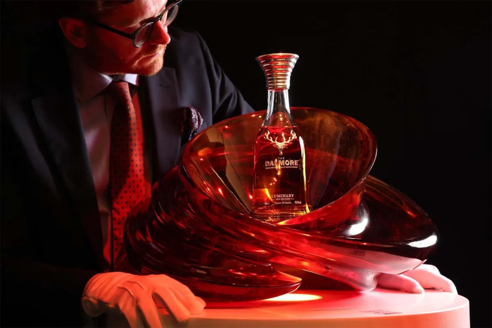 a man holding a glass of wine