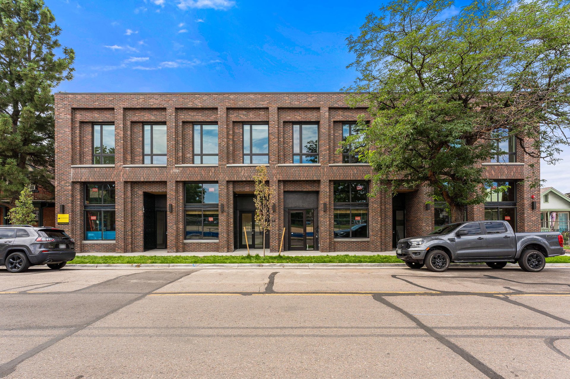 black and brown leather padded tub sofa