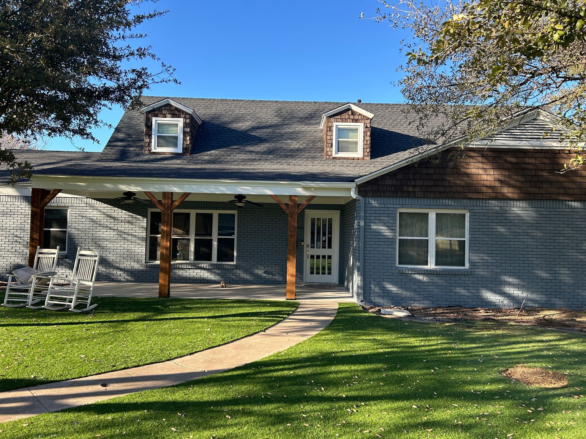 black and brown leather padded tub sofa