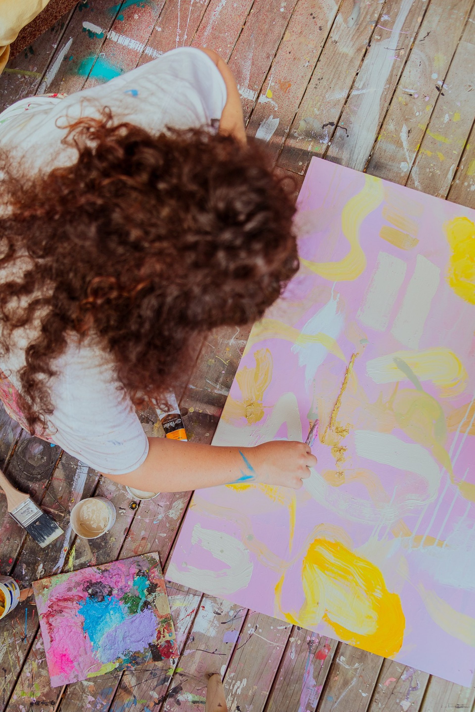 woman wearing yellow long-sleeved dress under white clouds and blue sky during daytime