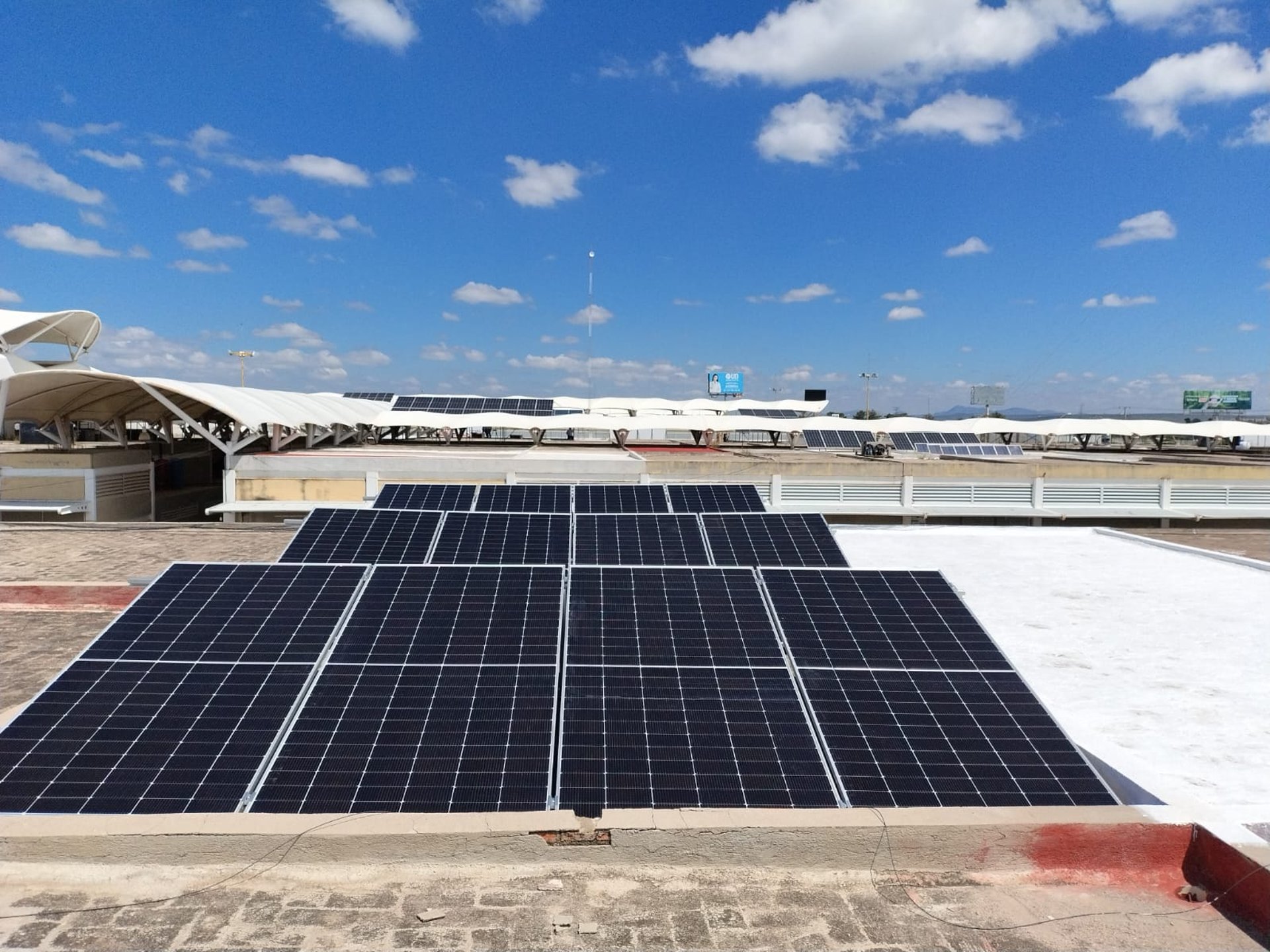 an abstract photo of a curved building with a blue sky in the background