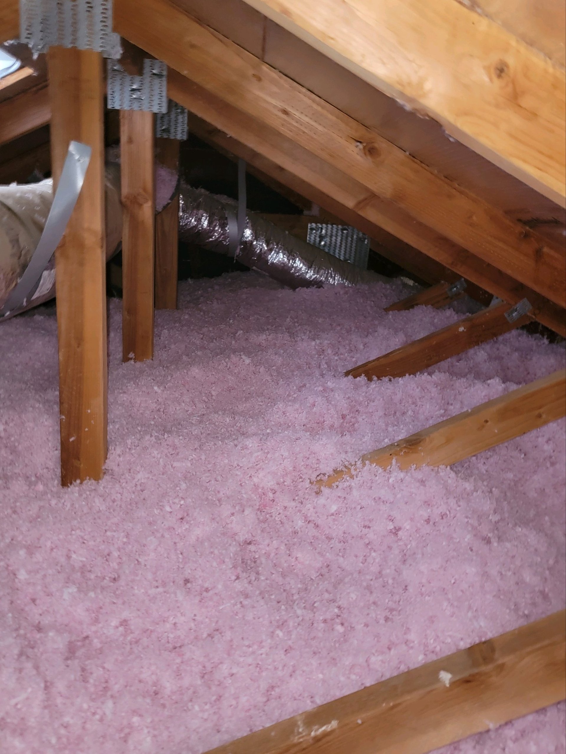 an abstract photo of a curved building with a blue sky in the background