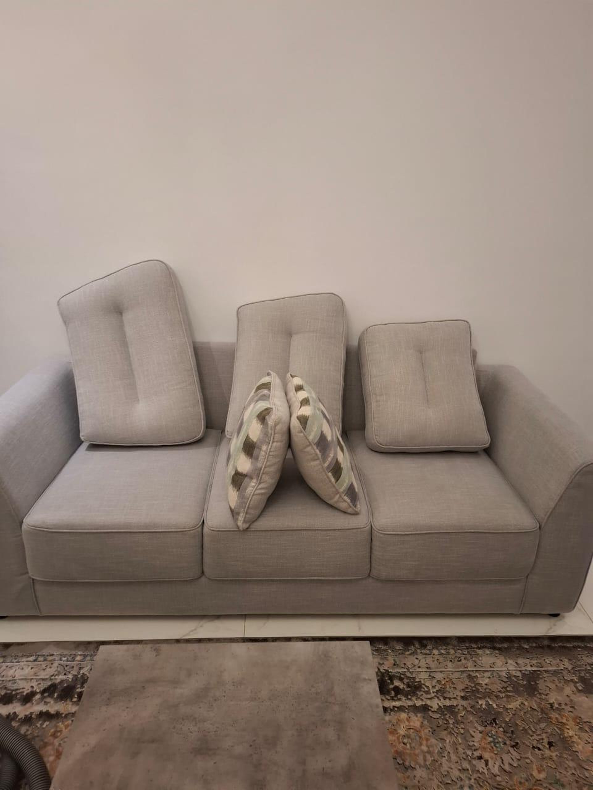 an abstract photo of a curved building with a blue sky in the background