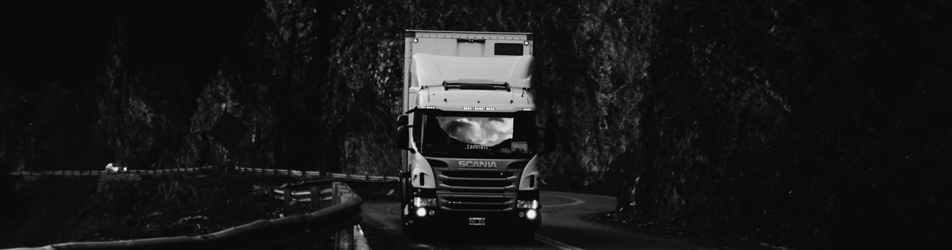 an abstract photo of a curved building with a blue sky in the background