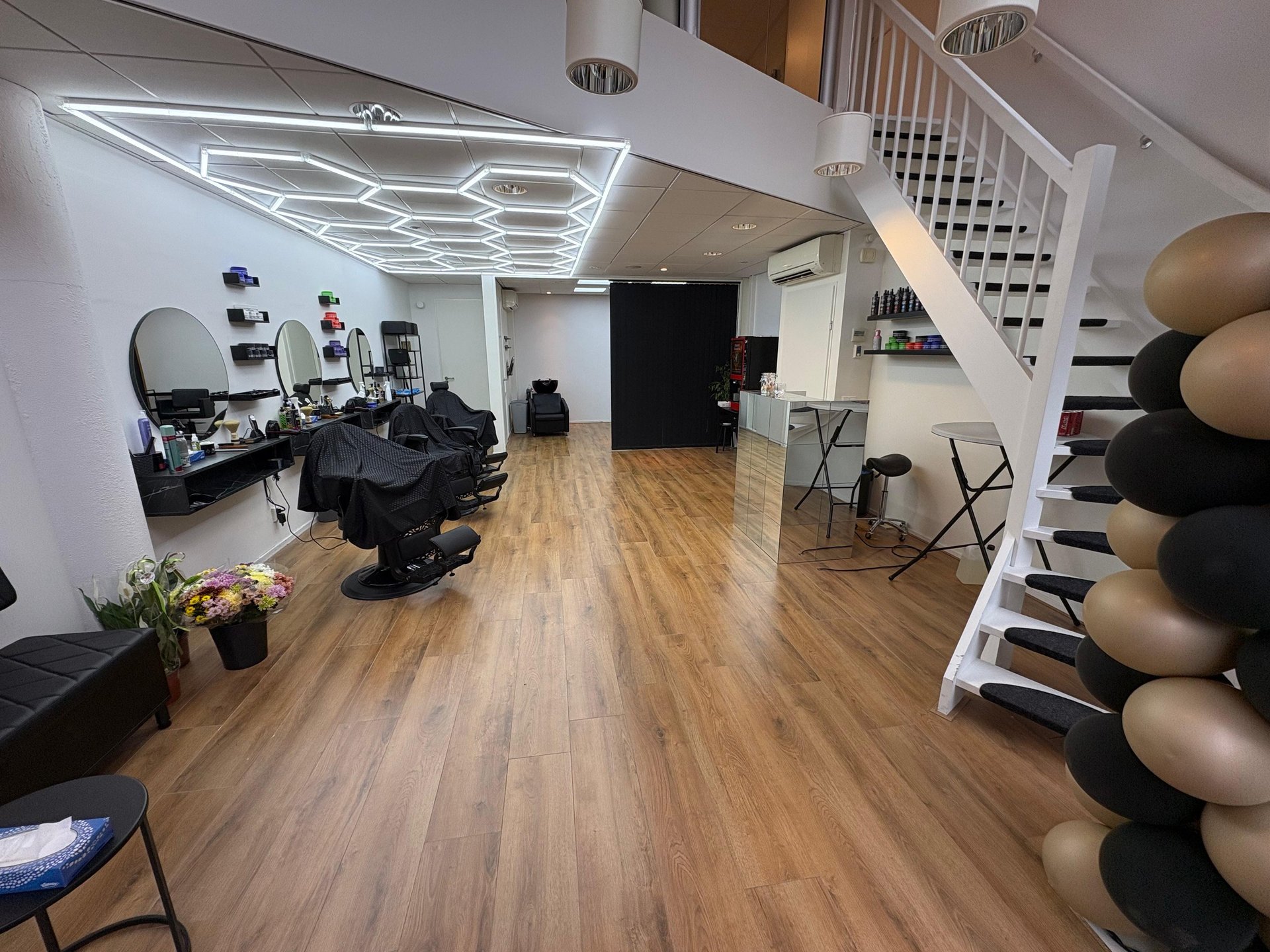 man sitting on barber's chair
